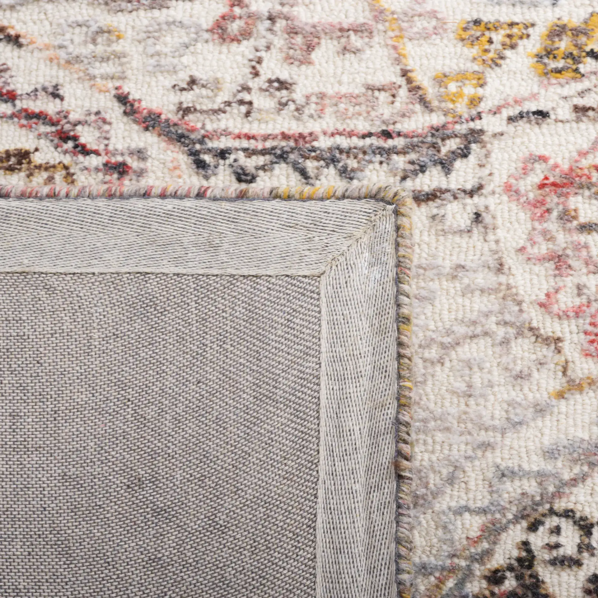 Metro Overlapping Medallion Hand-Tufted Wool Rug in Ivory / Red in a styled room