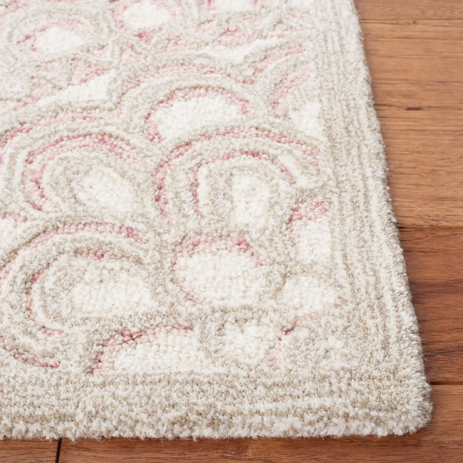 Metro Scalloped Medallion Hand-Tufted Wool Rug in Dark Pink / Ivory in a styled room