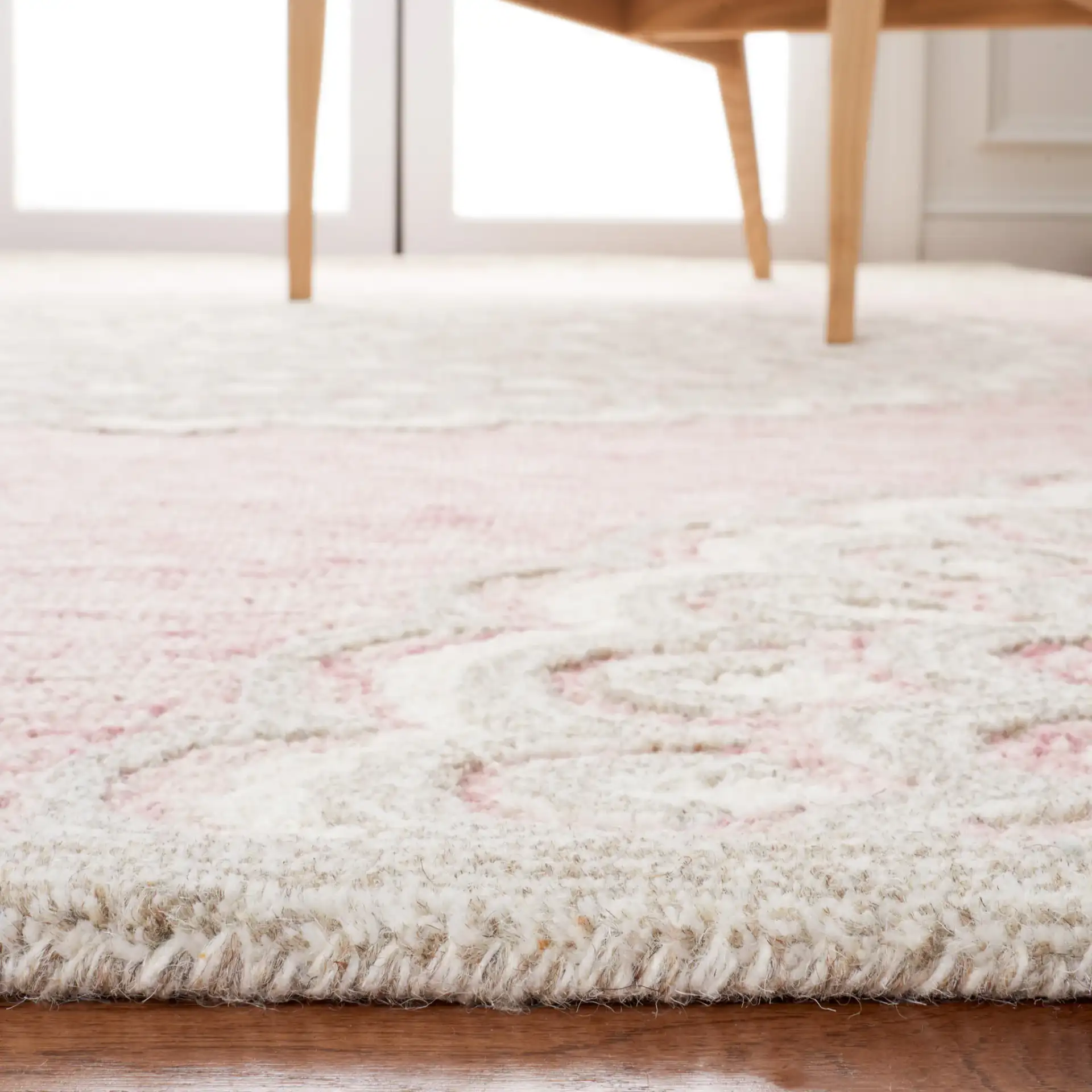 Metro Scalloped Medallion Hand-Tufted Wool Rug in Dark Pink / Ivory in a styled room