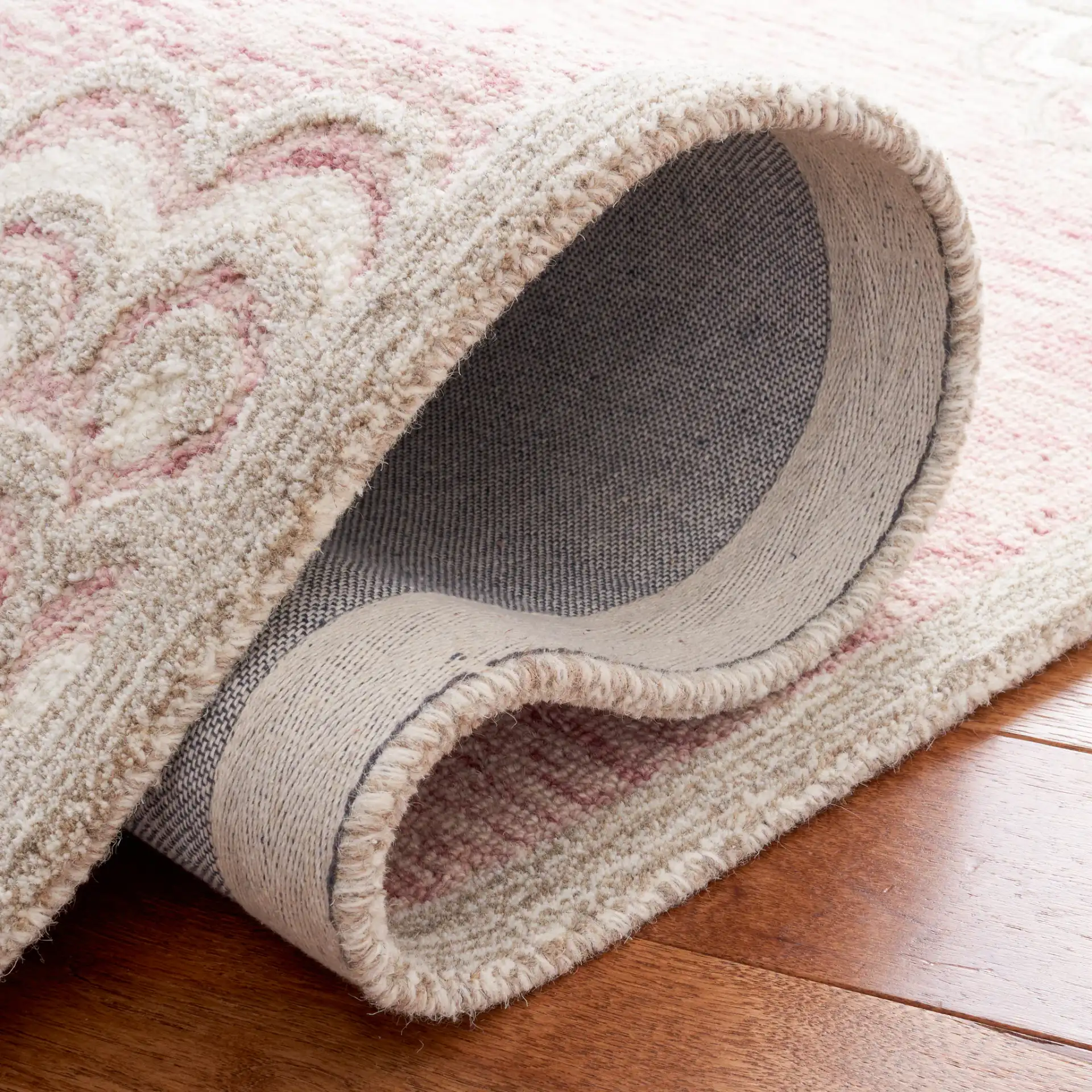 Metro Scalloped Medallion Hand-Tufted Wool Rug in Dark Pink / Ivory in a styled room