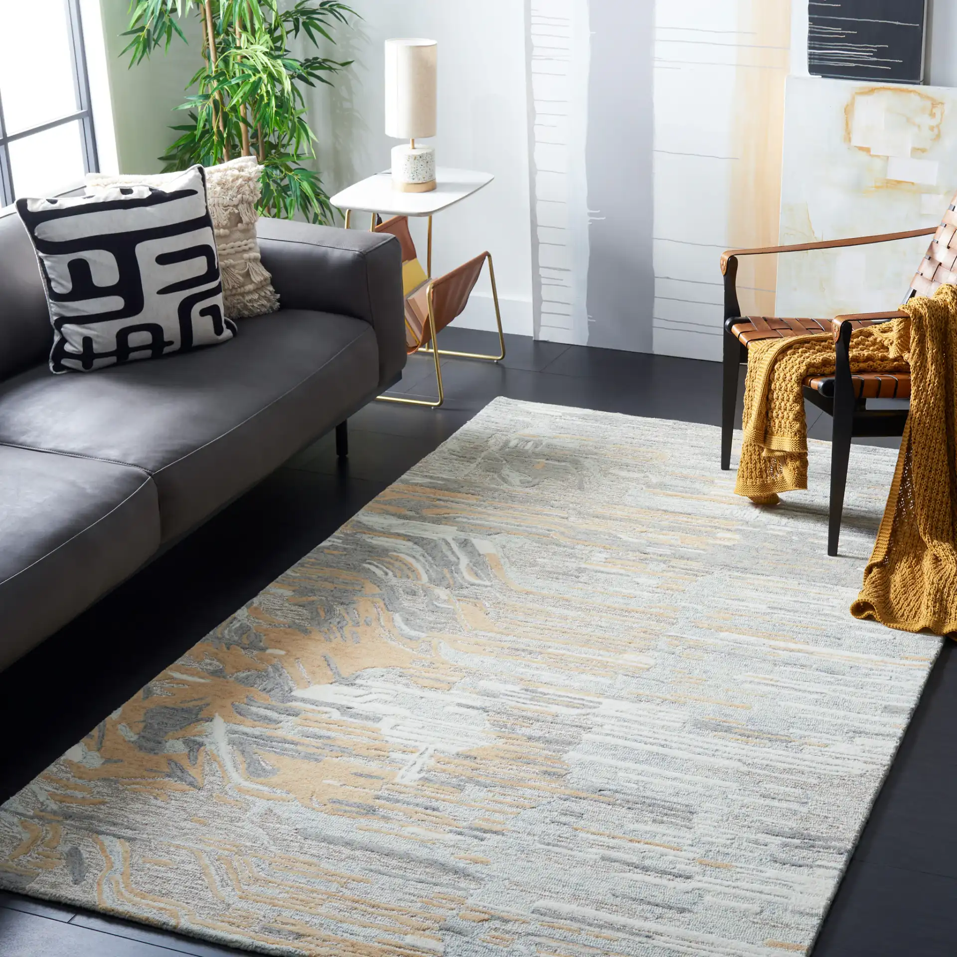 Metro Abstract Striated Hand-Tufted Wool Rug in Natural / Gold in a styled room