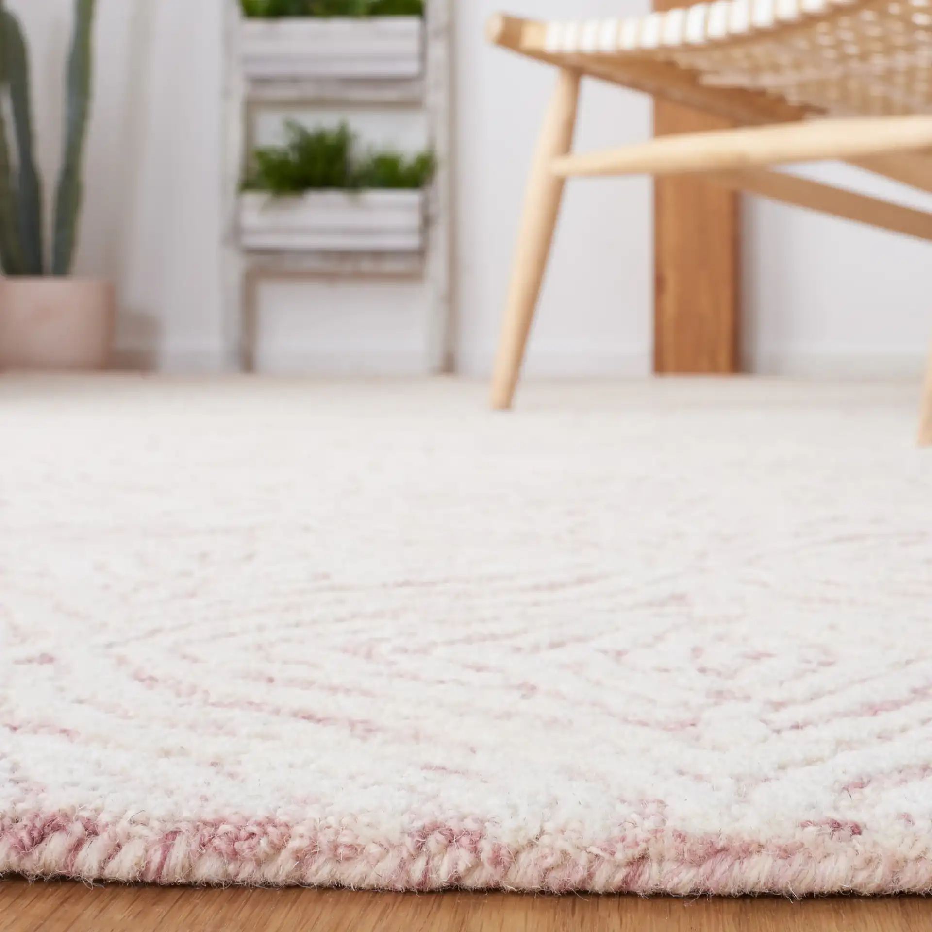 Metro Ogee Trellis Hand-Tufted Wool Rug in Dark Pink / Ivory in a styled room