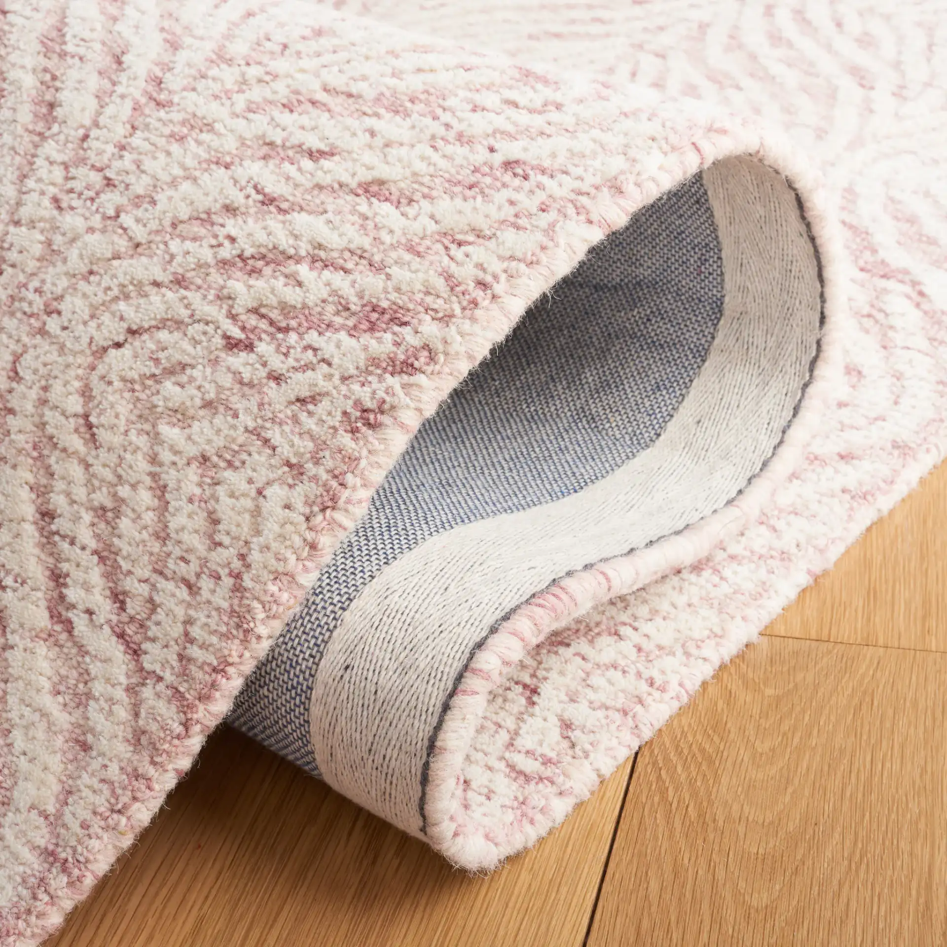 Metro Ogee Trellis Hand-Tufted Wool Rug in Dark Pink / Ivory in a styled room