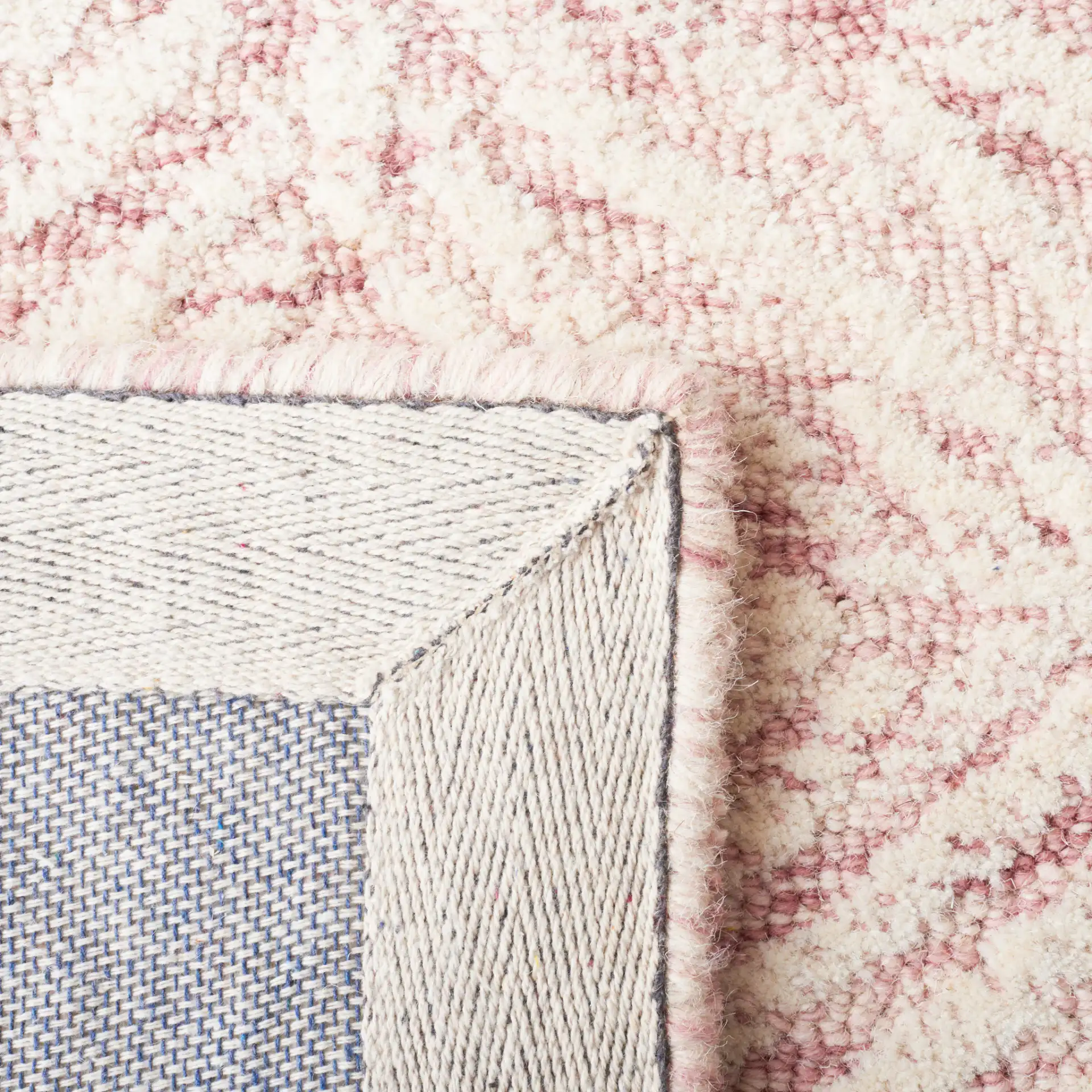 Metro Ogee Trellis Hand-Tufted Wool Rug in Dark Pink / Ivory in a styled room