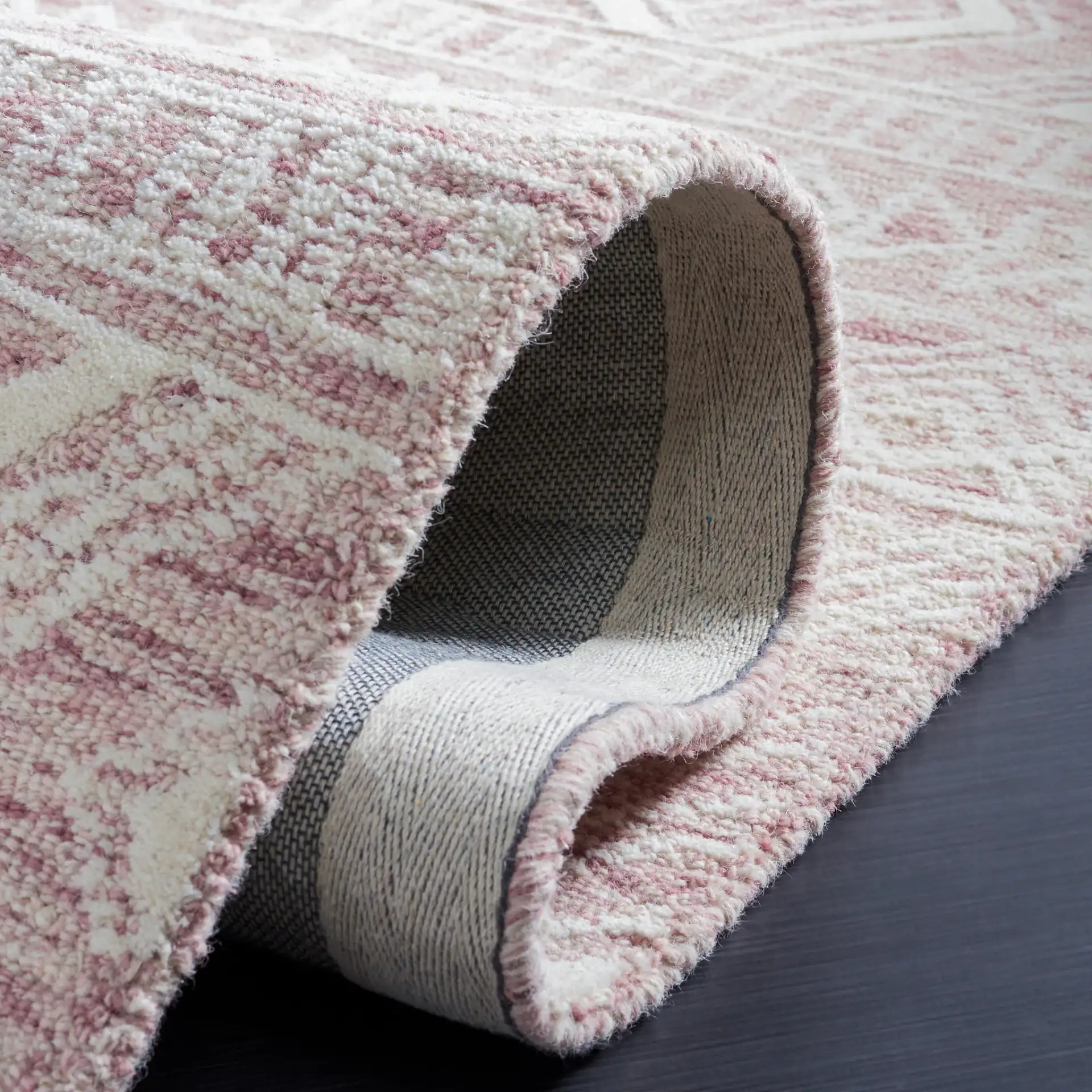 Metro Tribal Banded Hand-Tufted Wool Rug in Dark Pink / Ivory in a styled room
