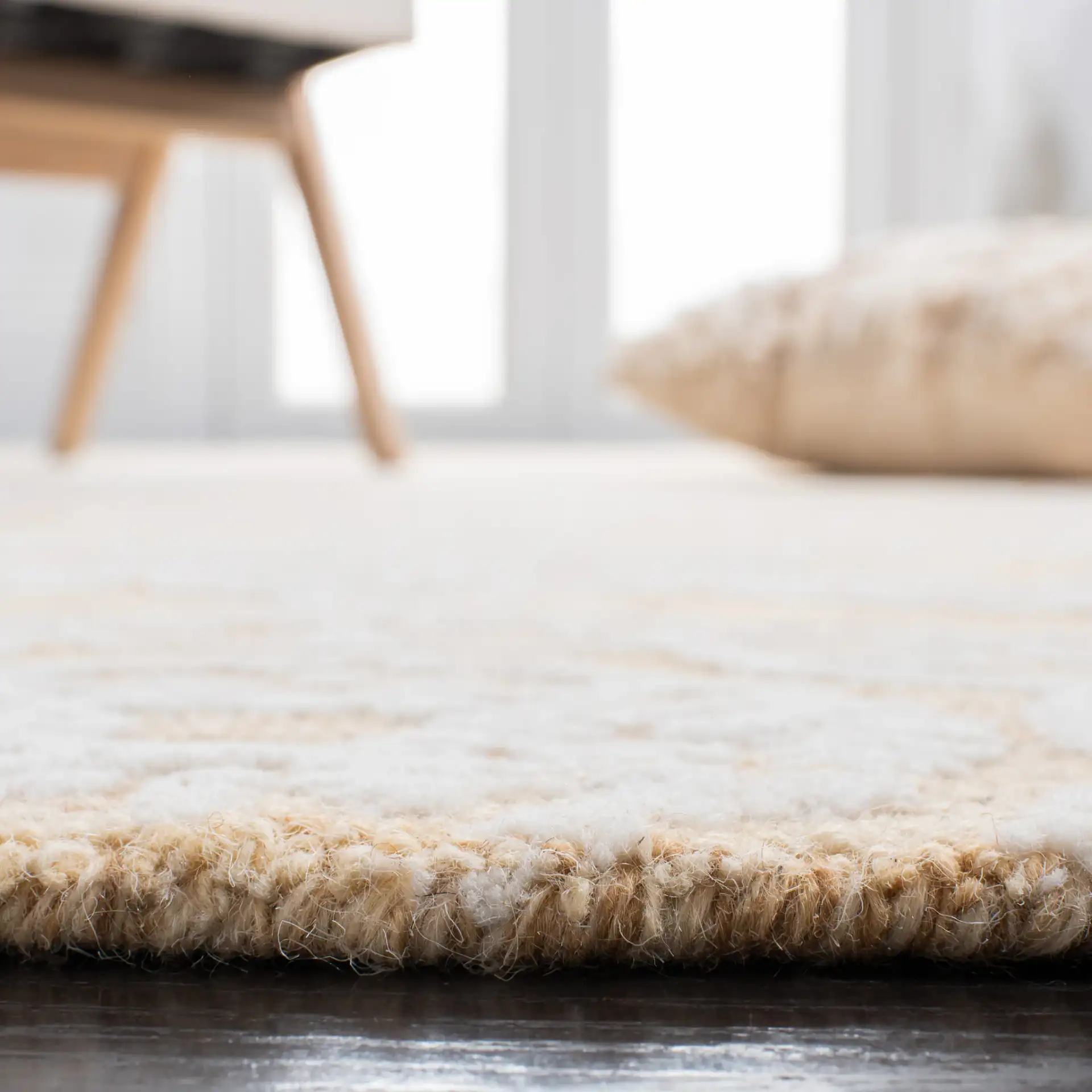 Metro Damask Medallion Hand-Tufted Wool Rug in Gold / Ivory in a styled room