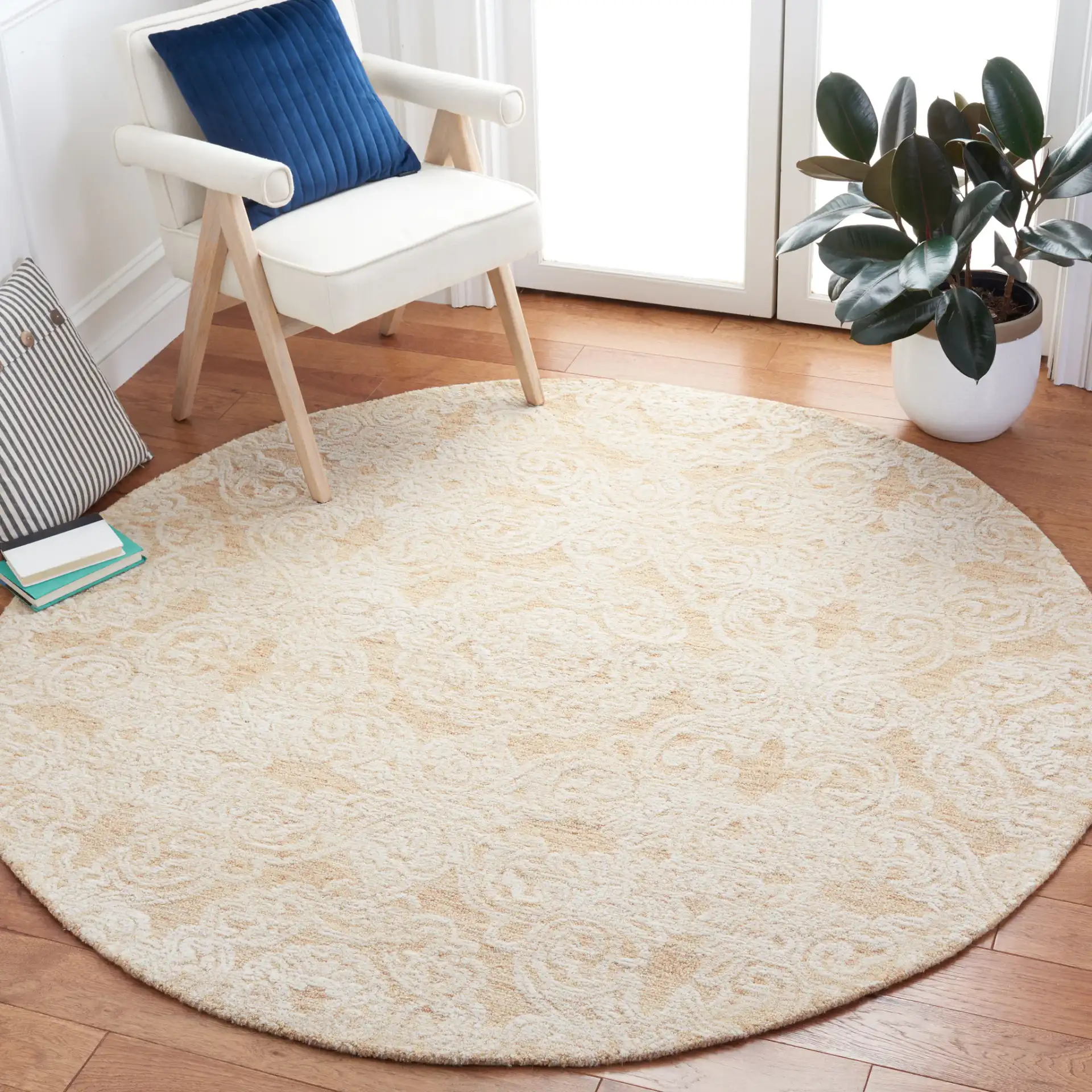 Metro Damask Medallion Hand-Tufted Wool Rug in Gold / Ivory in a styled room