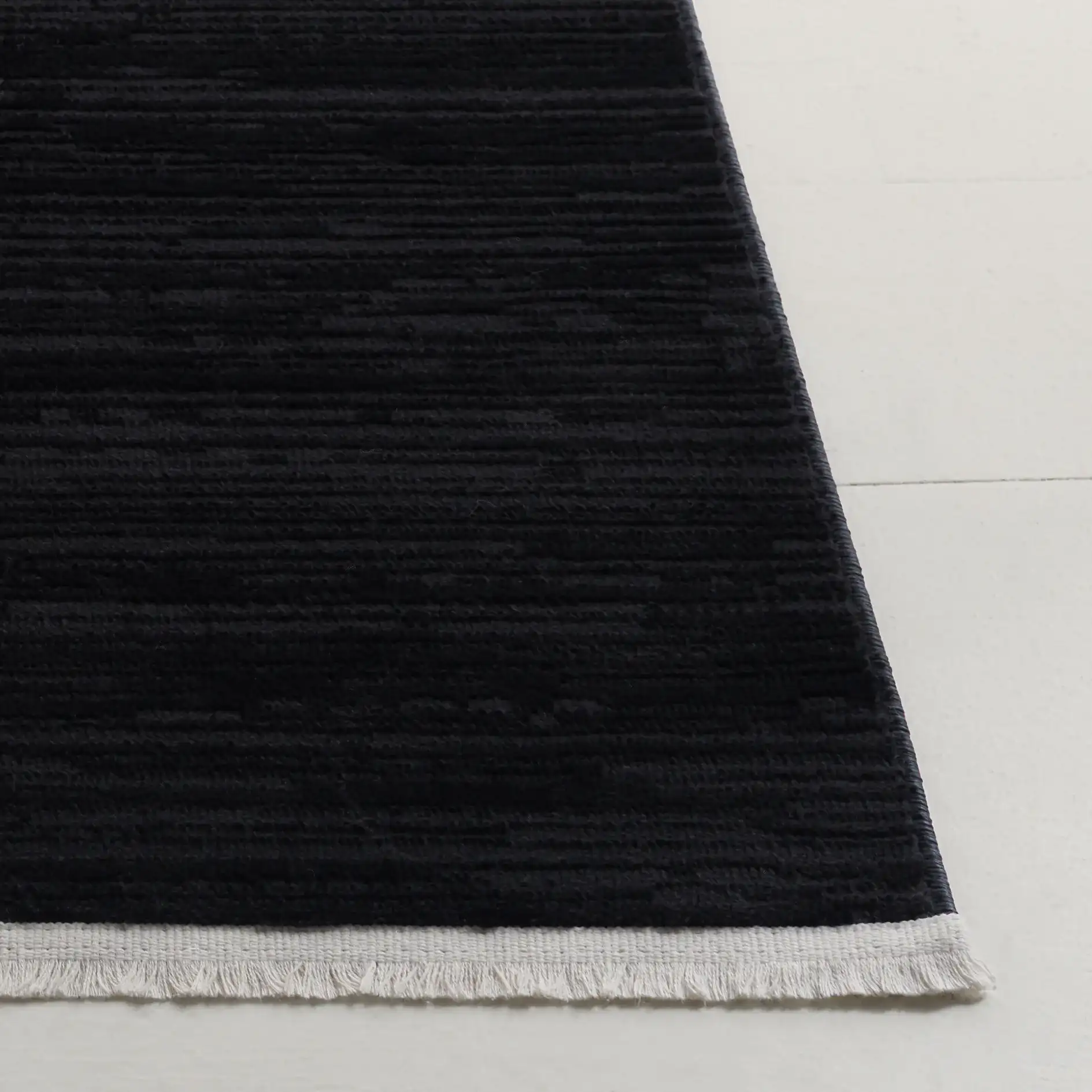 Mila Linear Stripe Rug in Beige / Black in a styled room