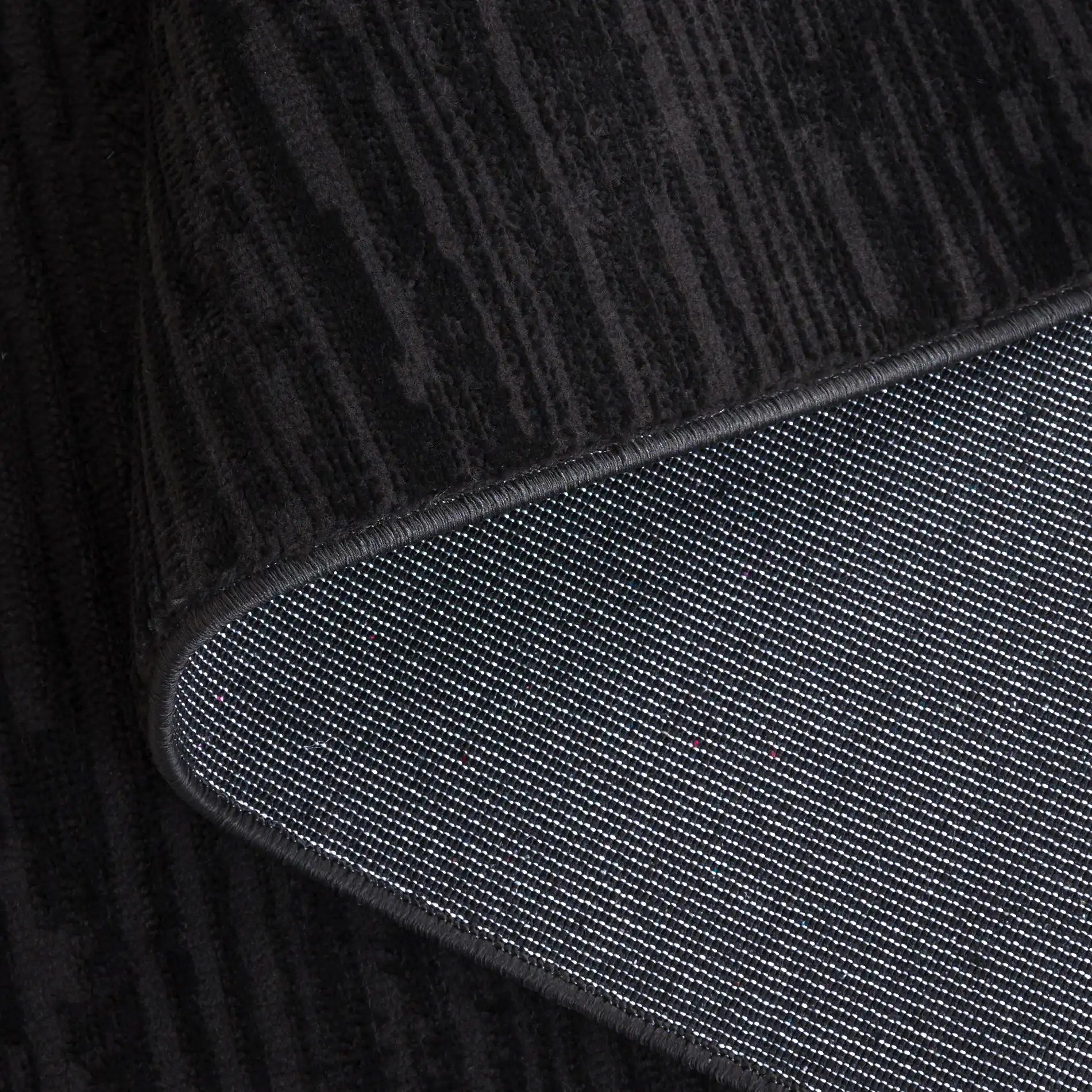 Mila Linear Stripe Rug in Beige / Black in a styled room