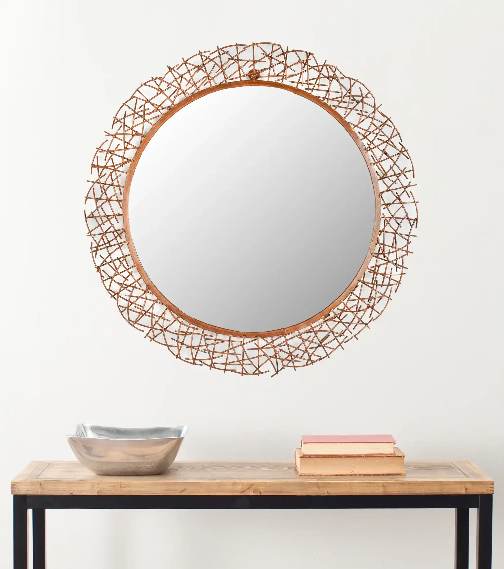 Twig Mirror in Burnt Copper in a styled room