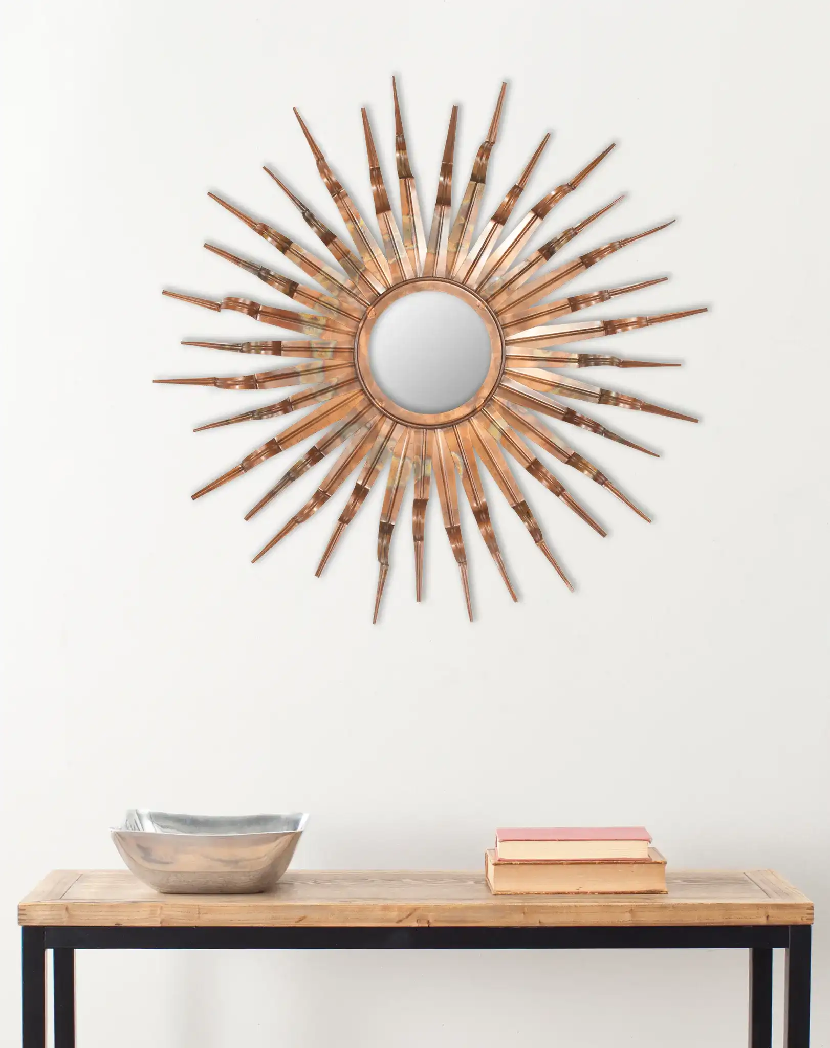 Sun Mirror in Burnt Copper in a styled room