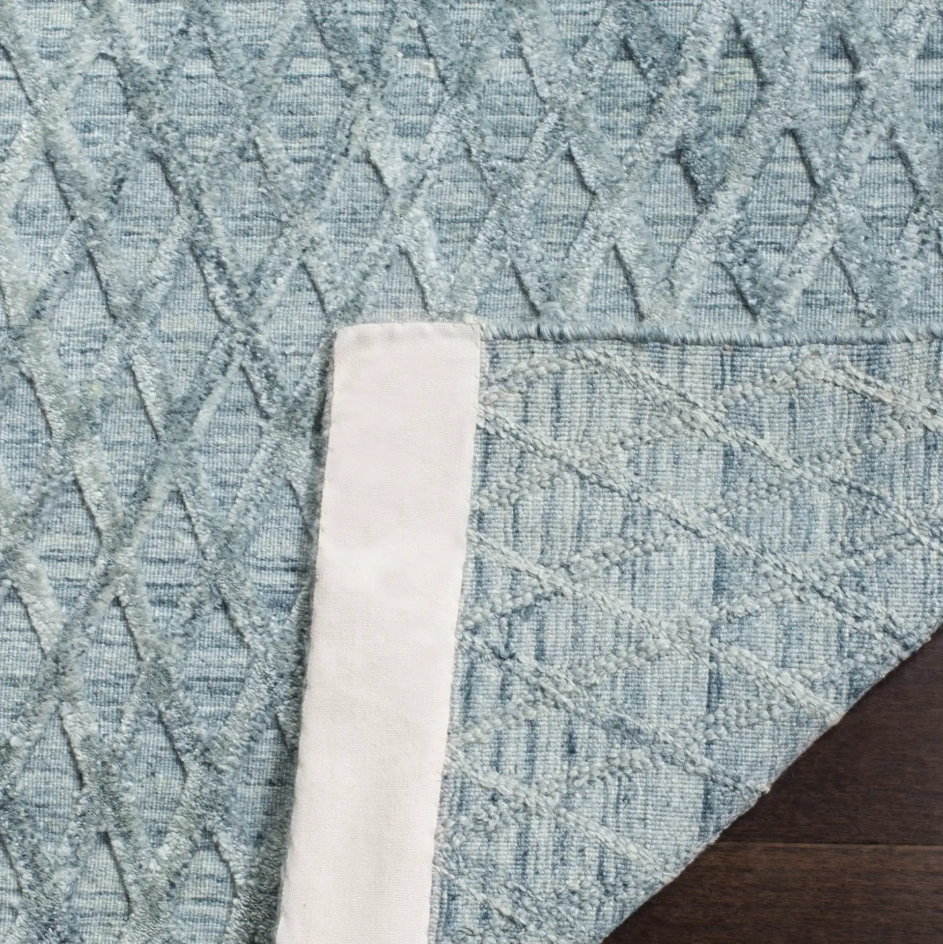 Mirage Diamond Grid Hand-Loomed Rug in Indigo in a styled room