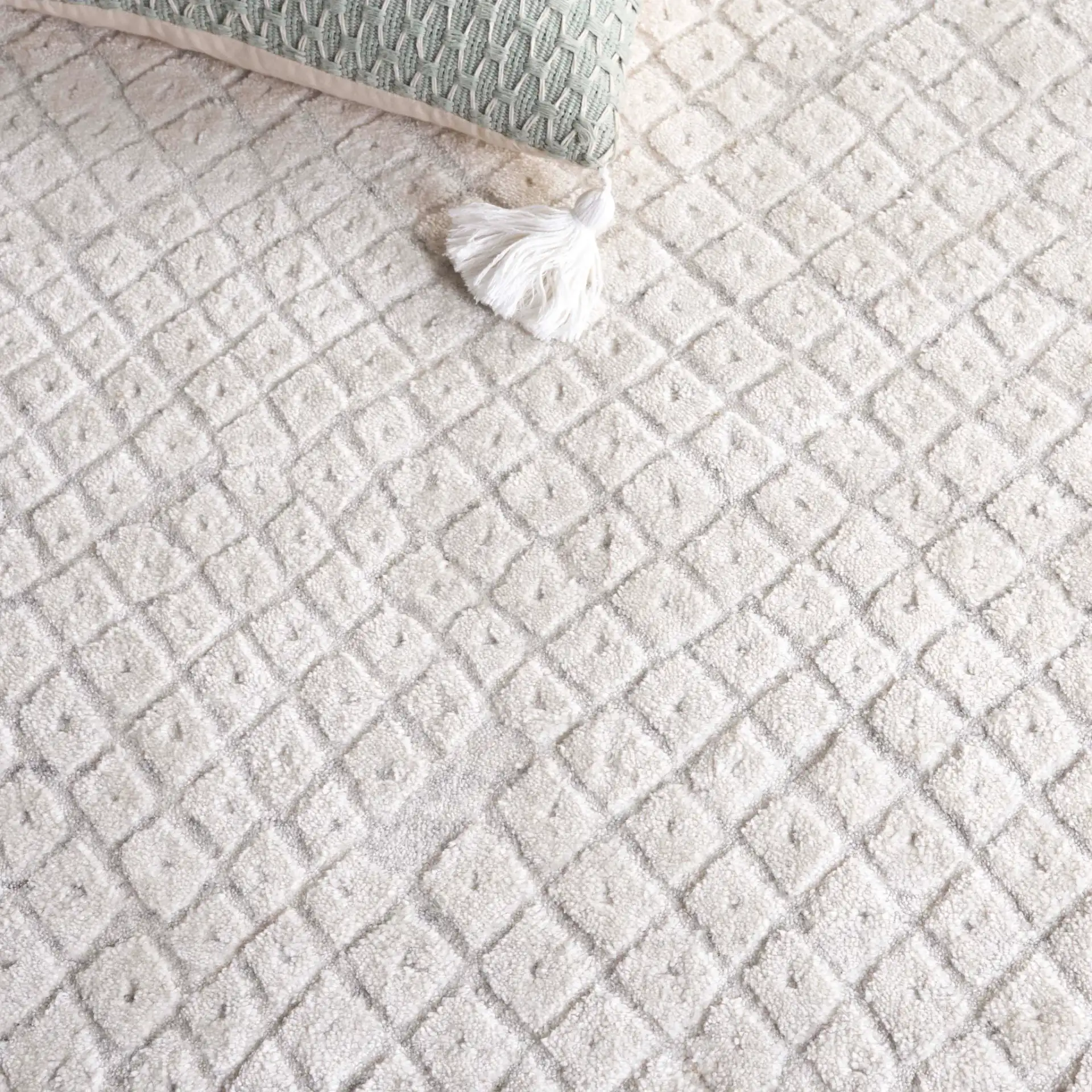 Mirage Micro-Diamond Hand-Loomed Rug in Ivory in a styled room