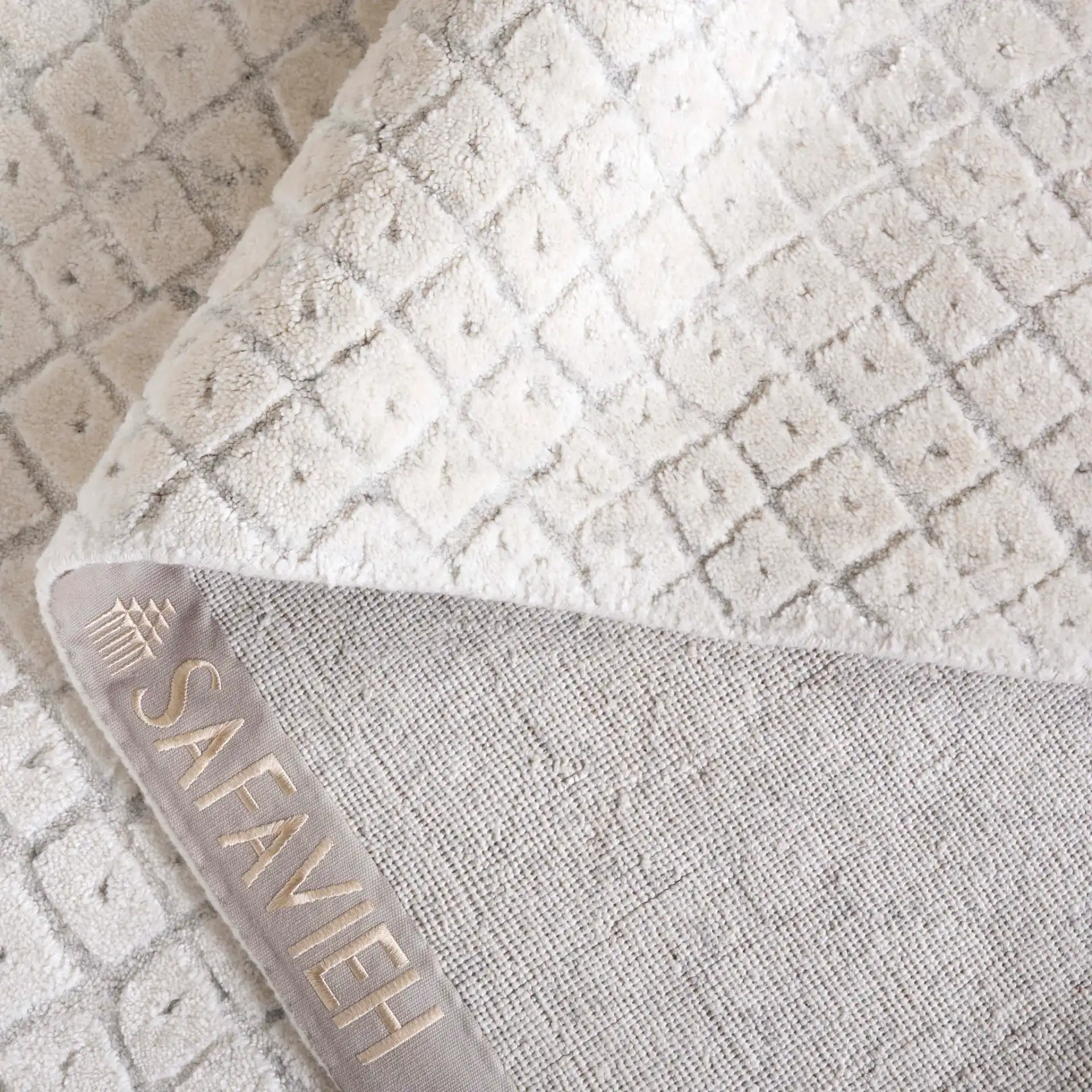 Mirage Micro-Diamond Hand-Loomed Rug in Ivory in a styled room