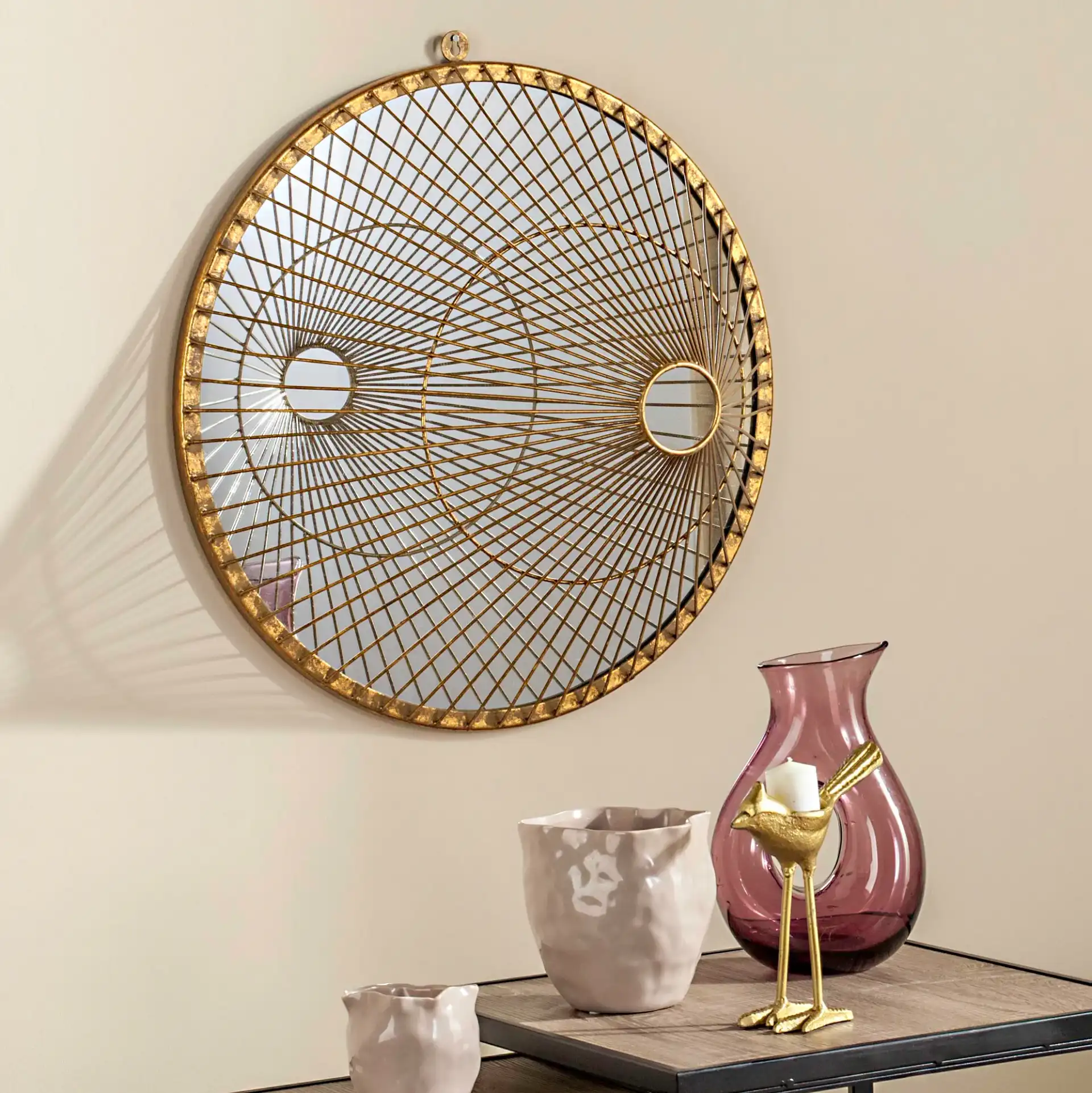Gemini Mirror in Gold in a styled room