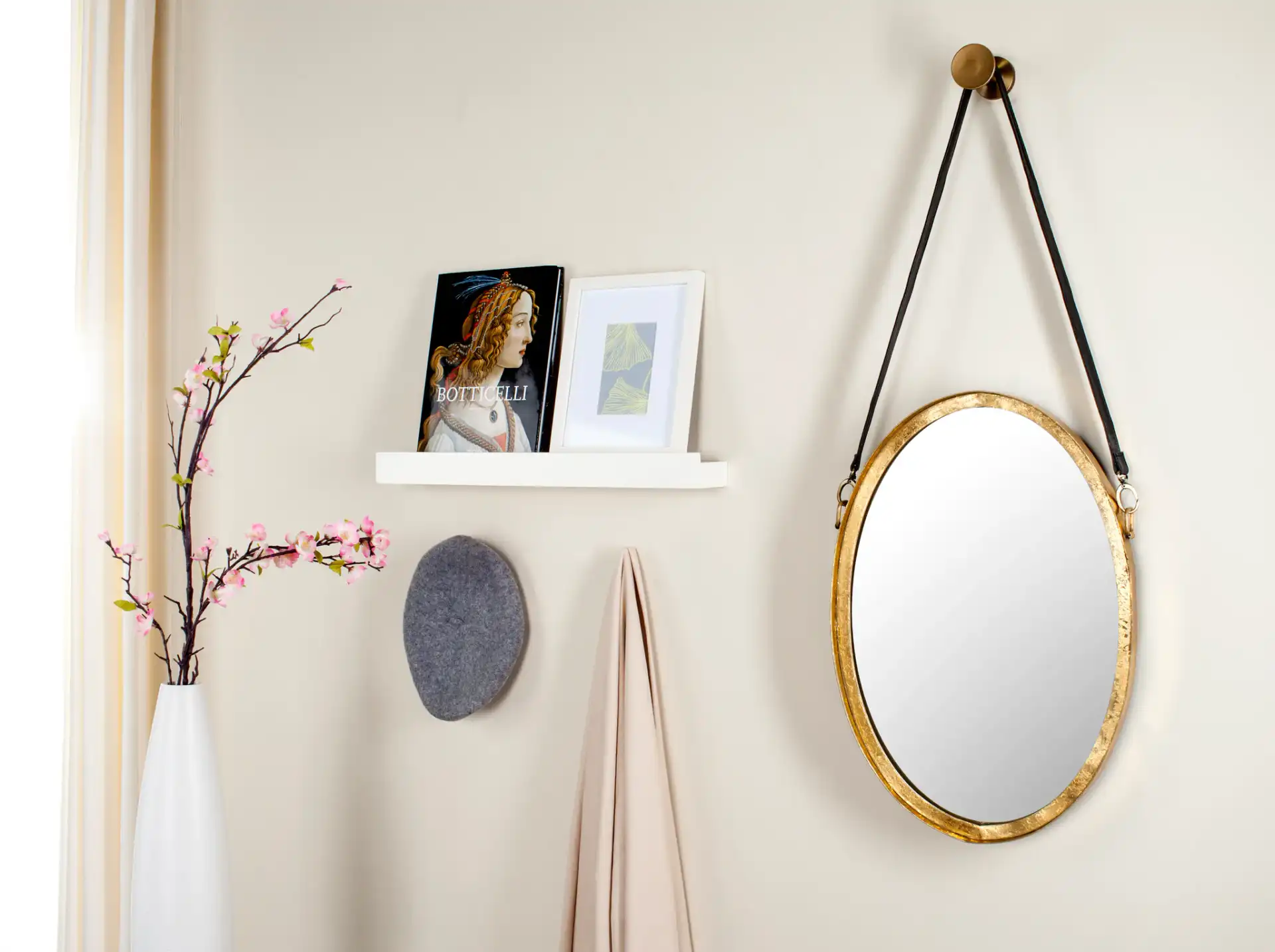 Pembroke Strap Mirror in Antique Gold in a styled room