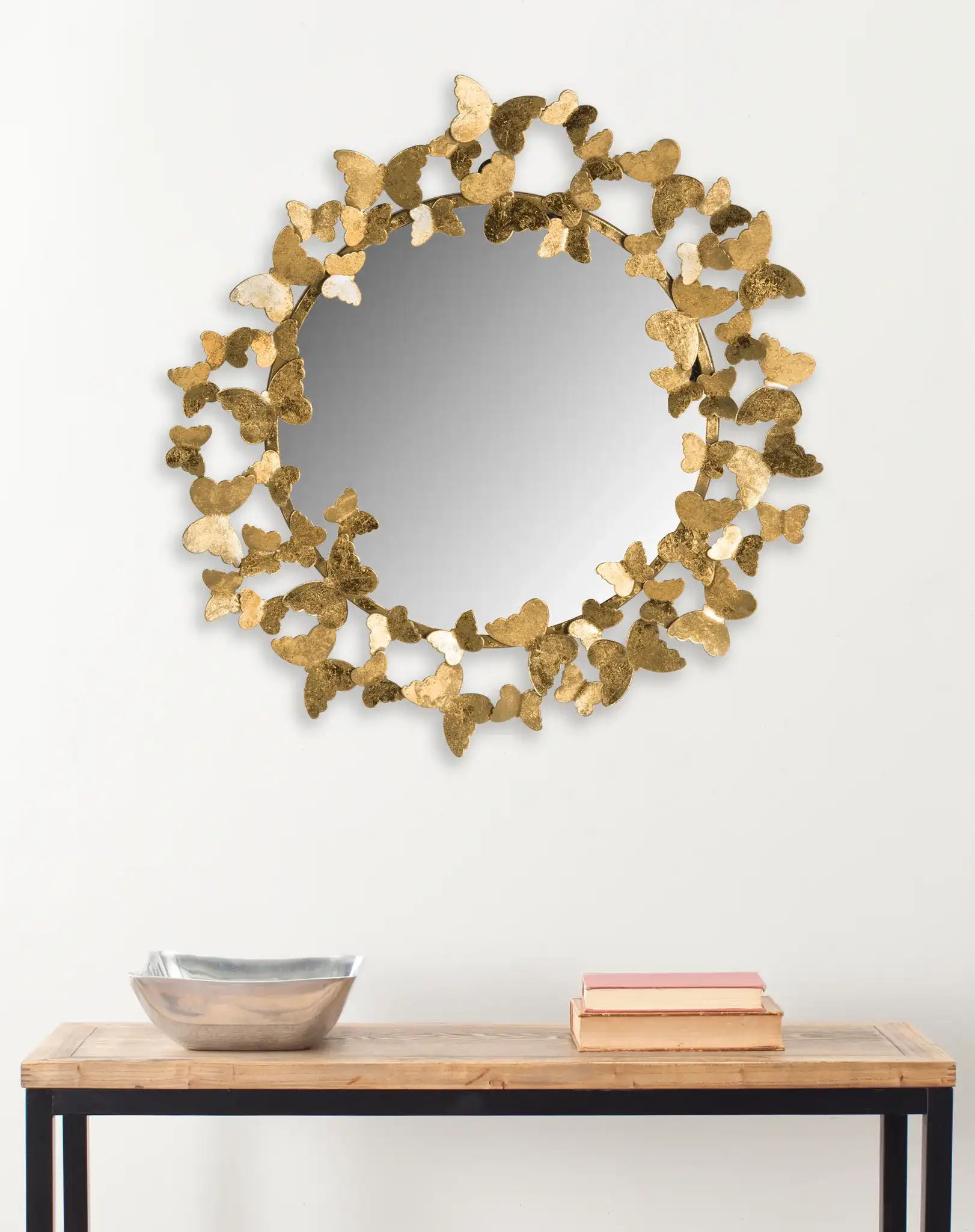 Ruthie Butterfly Mirror in Gold in a styled room