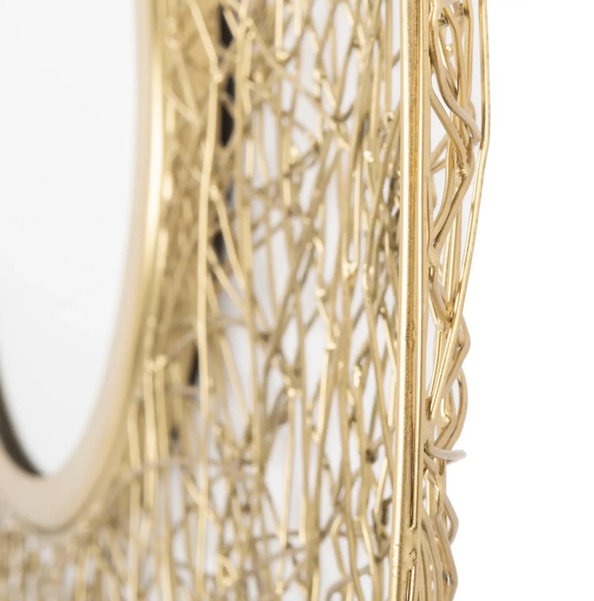 Harner Mirror in Shiny Brass Finish in a styled room
