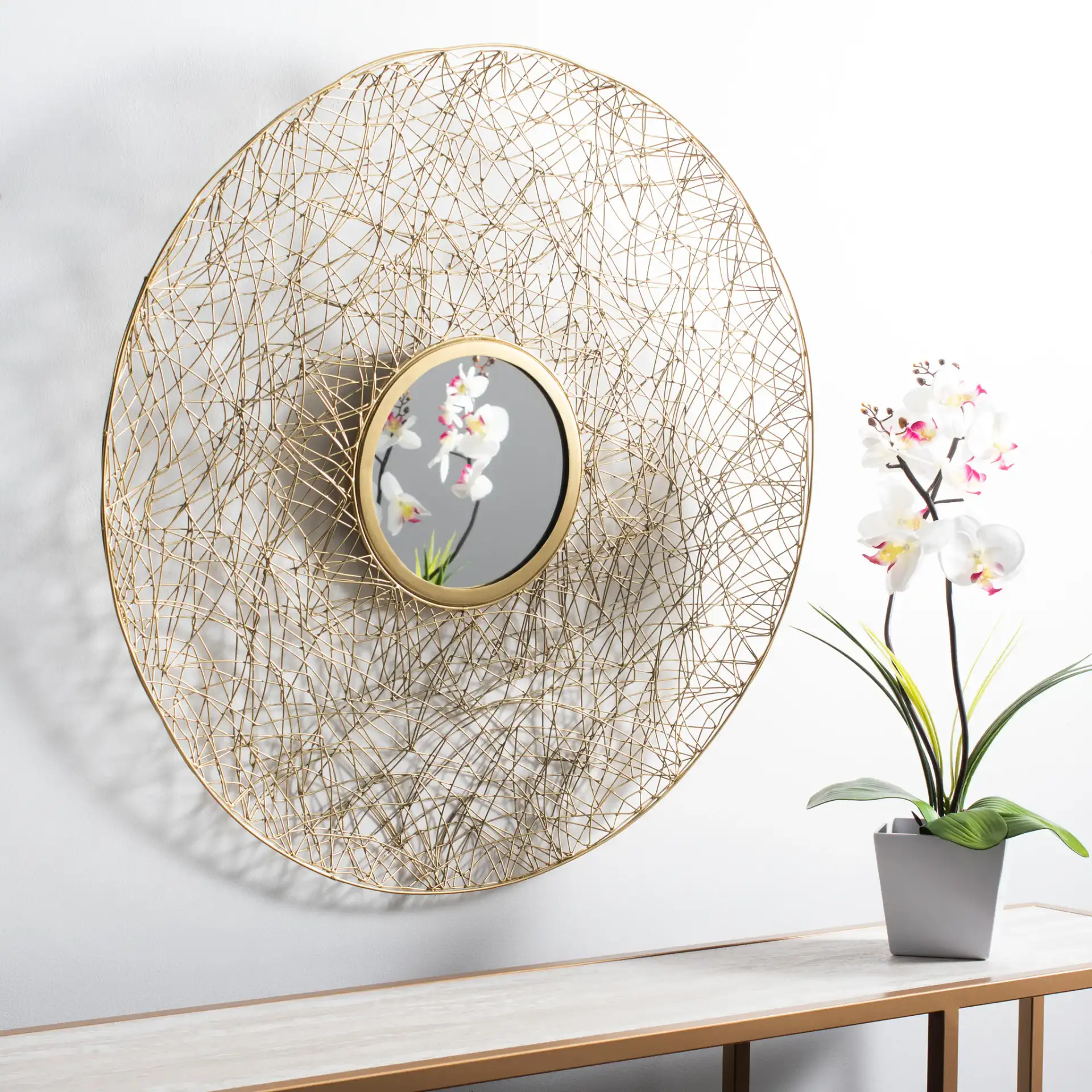 Harner Mirror in Shiny Brass Finish in a styled room