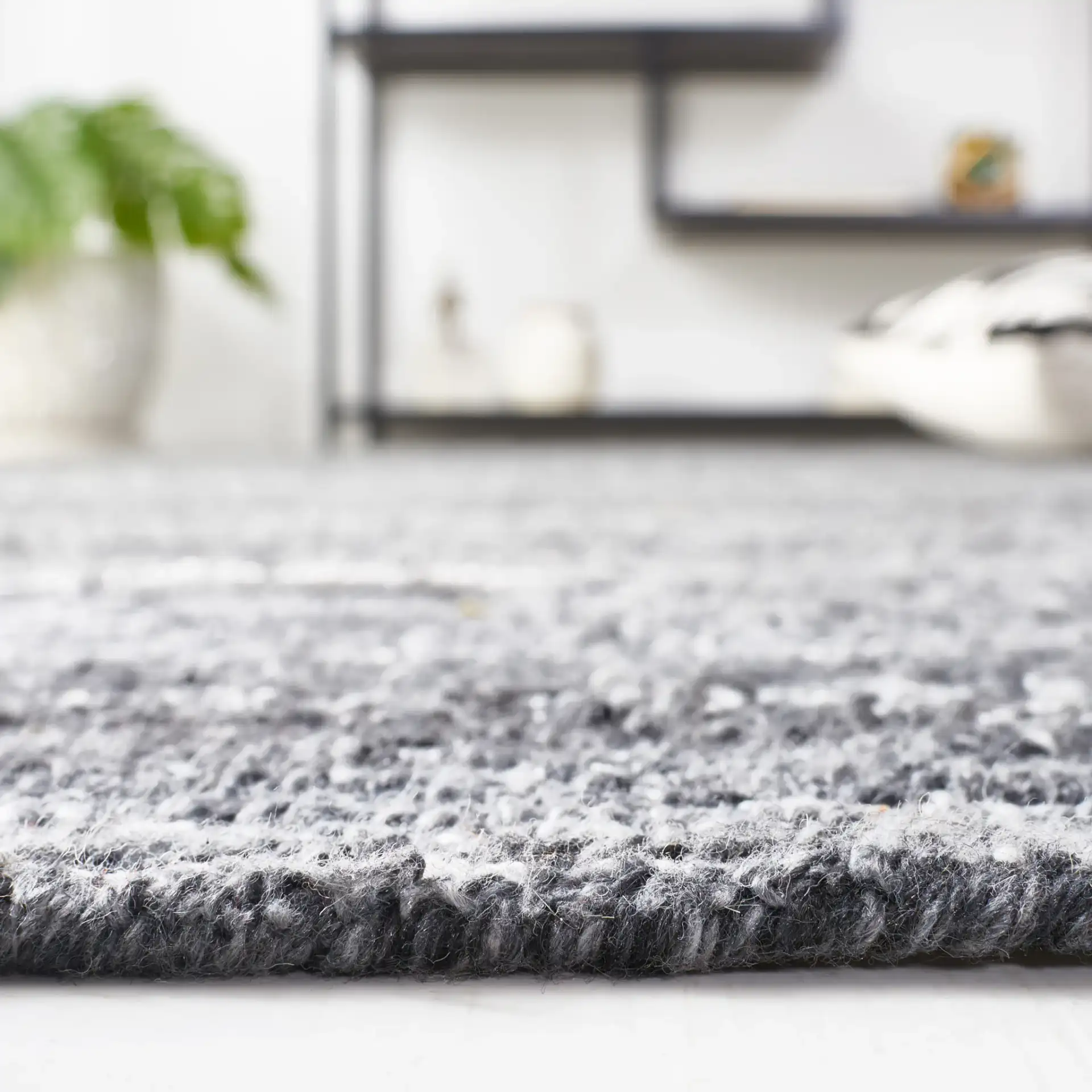 Mirage Ribbed Hand-Tufted Rug in Dark Gray / Ivory in a styled room
