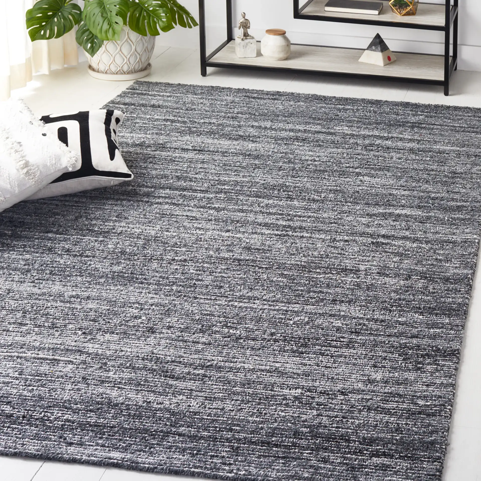 Mirage Ribbed Hand-Tufted Rug in Dark Gray / Ivory in a styled room