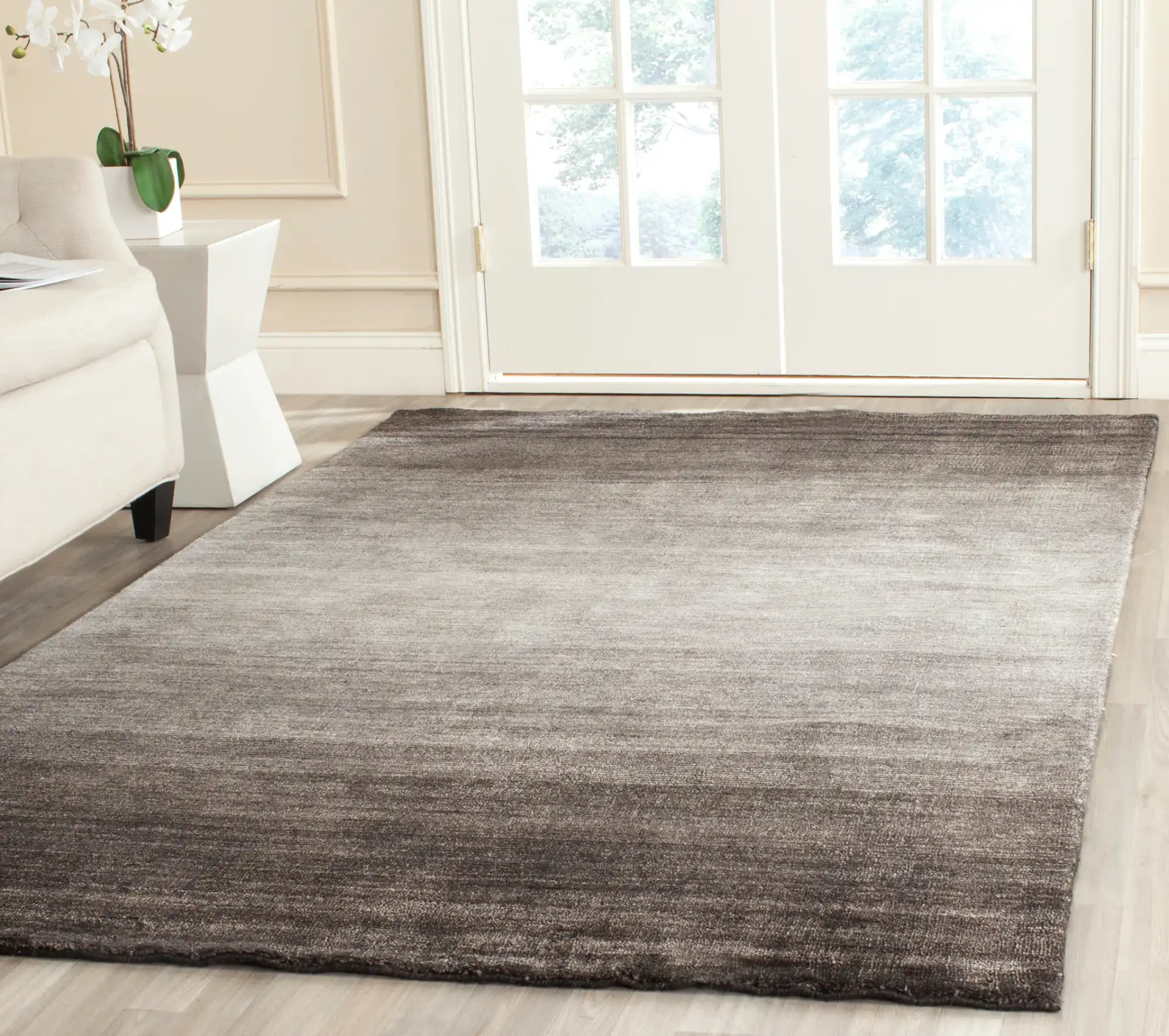 Mirage Gradient Hand-Loomed Rug in Black in a styled room