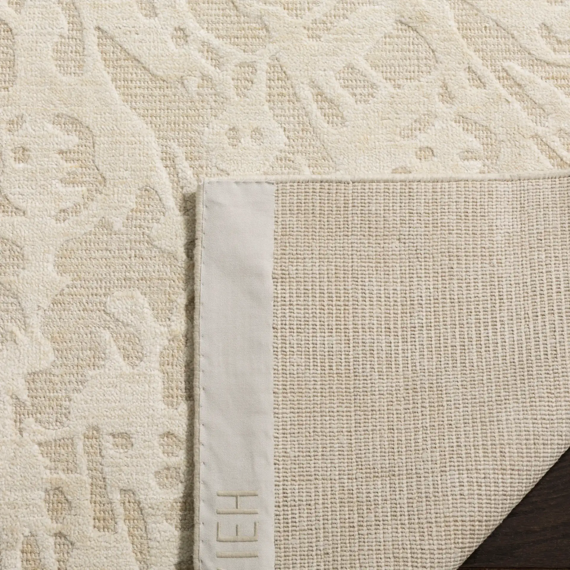 Mirage Radial Burst Hand-Loomed Rug in Beige in a styled room
