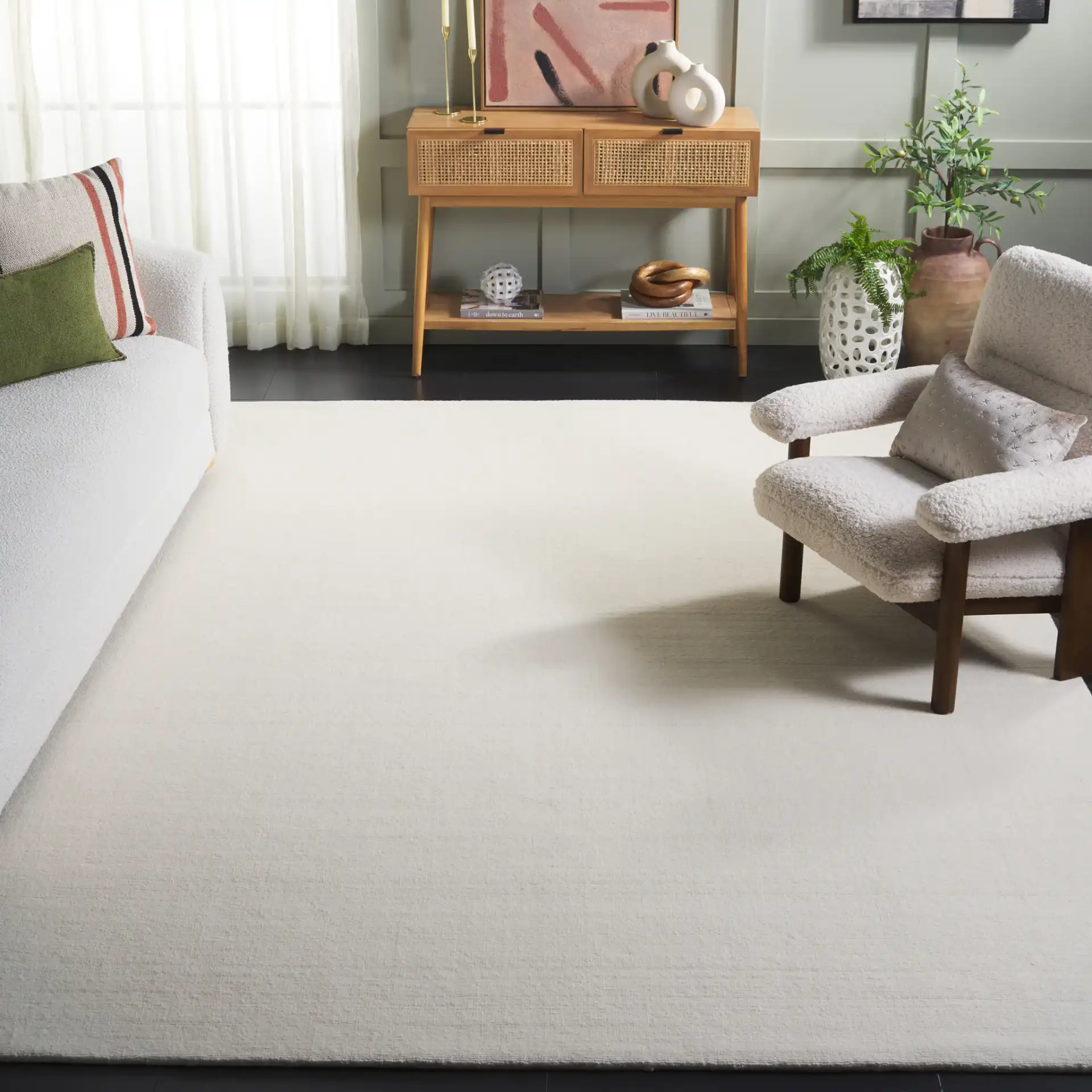 Mirage Solid Hand-Loomed Wool Rug in Ivory in a styled room
