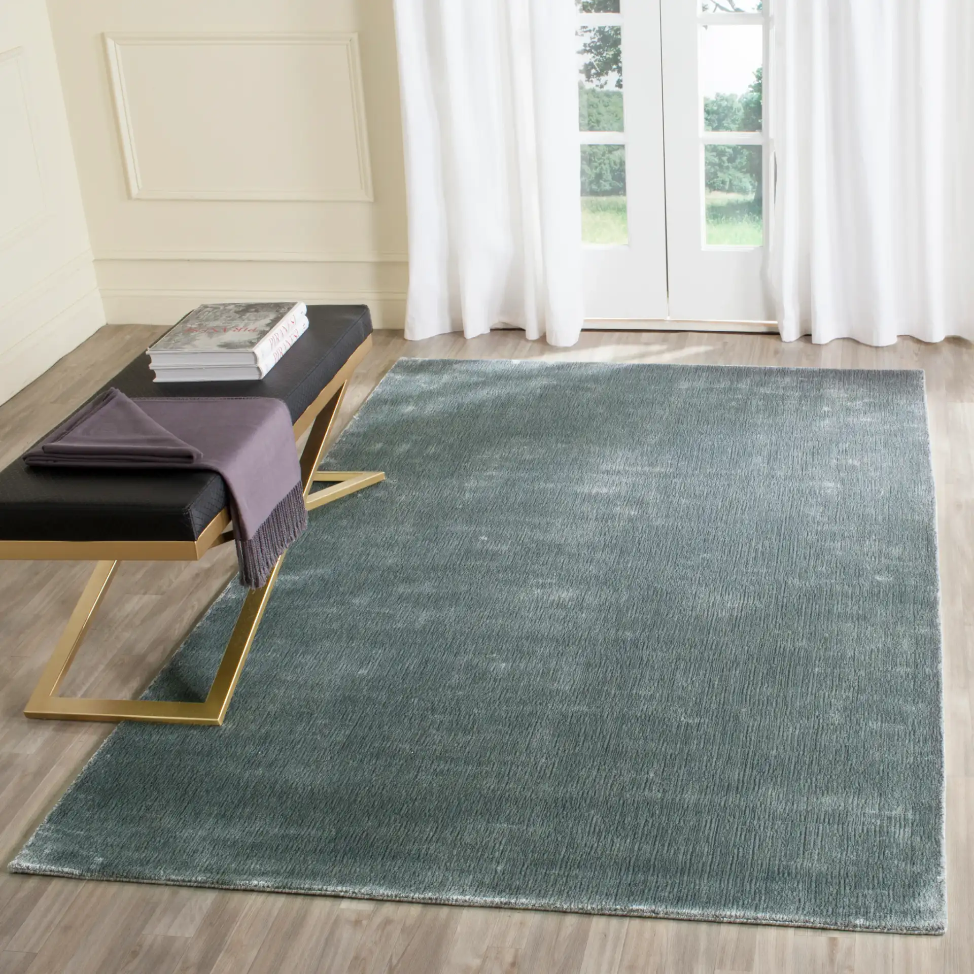 Mirage Solid Hand-Loomed Rug in Rock in a styled room