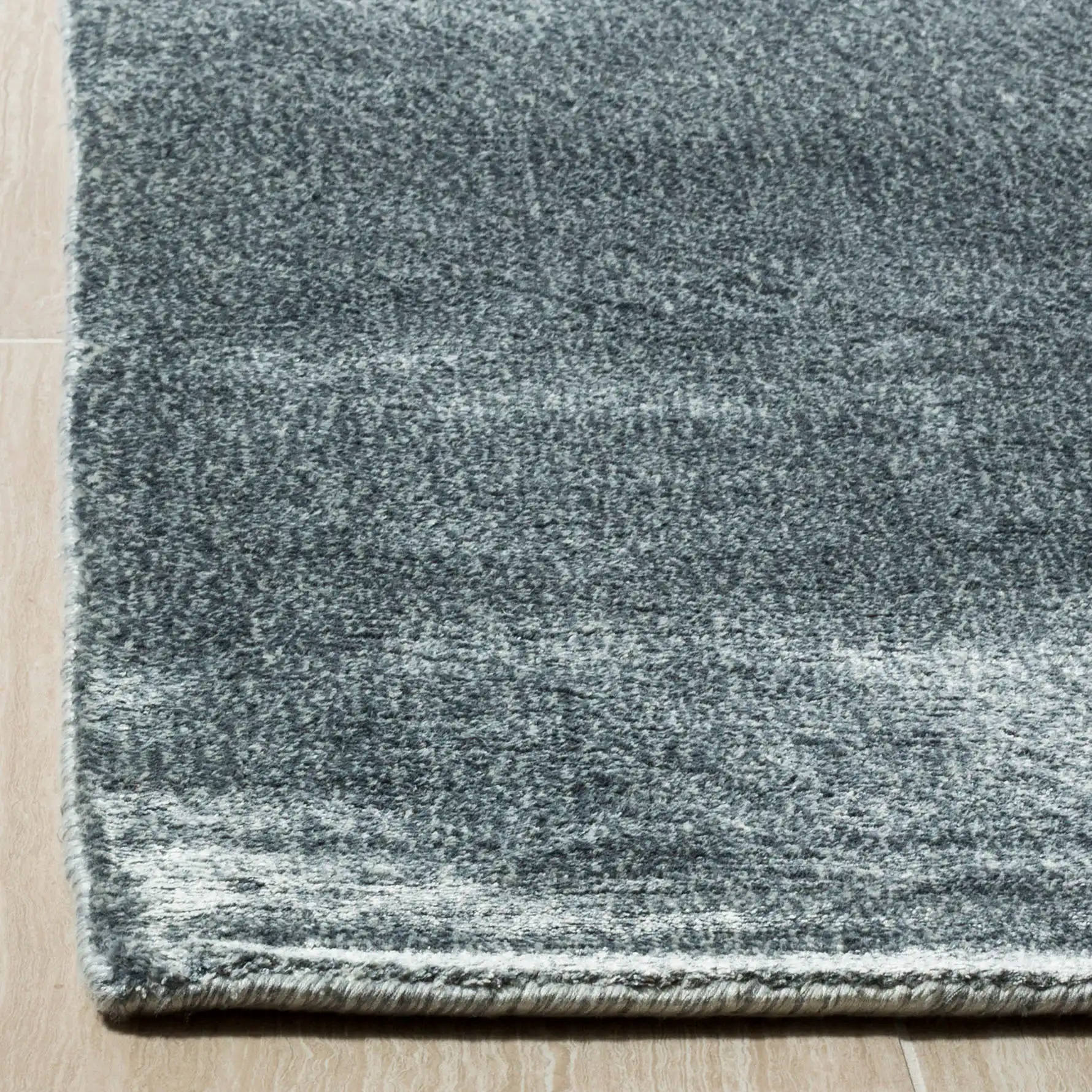 Mirage Solid Hand-Loomed Rug in Elephant in a styled room