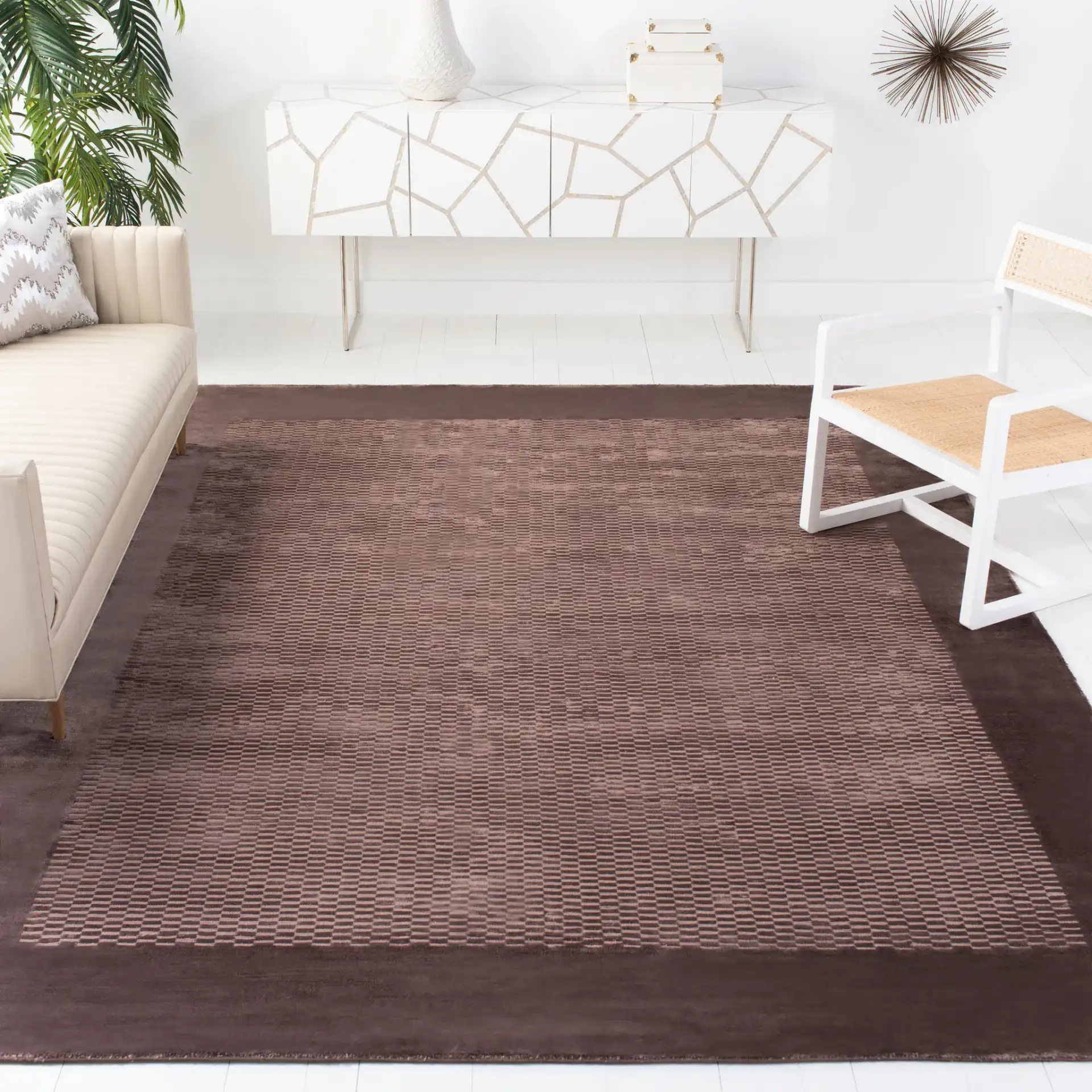 Mirage Textured Border Hand-Loomed Viscose Rug in Brown in a styled room