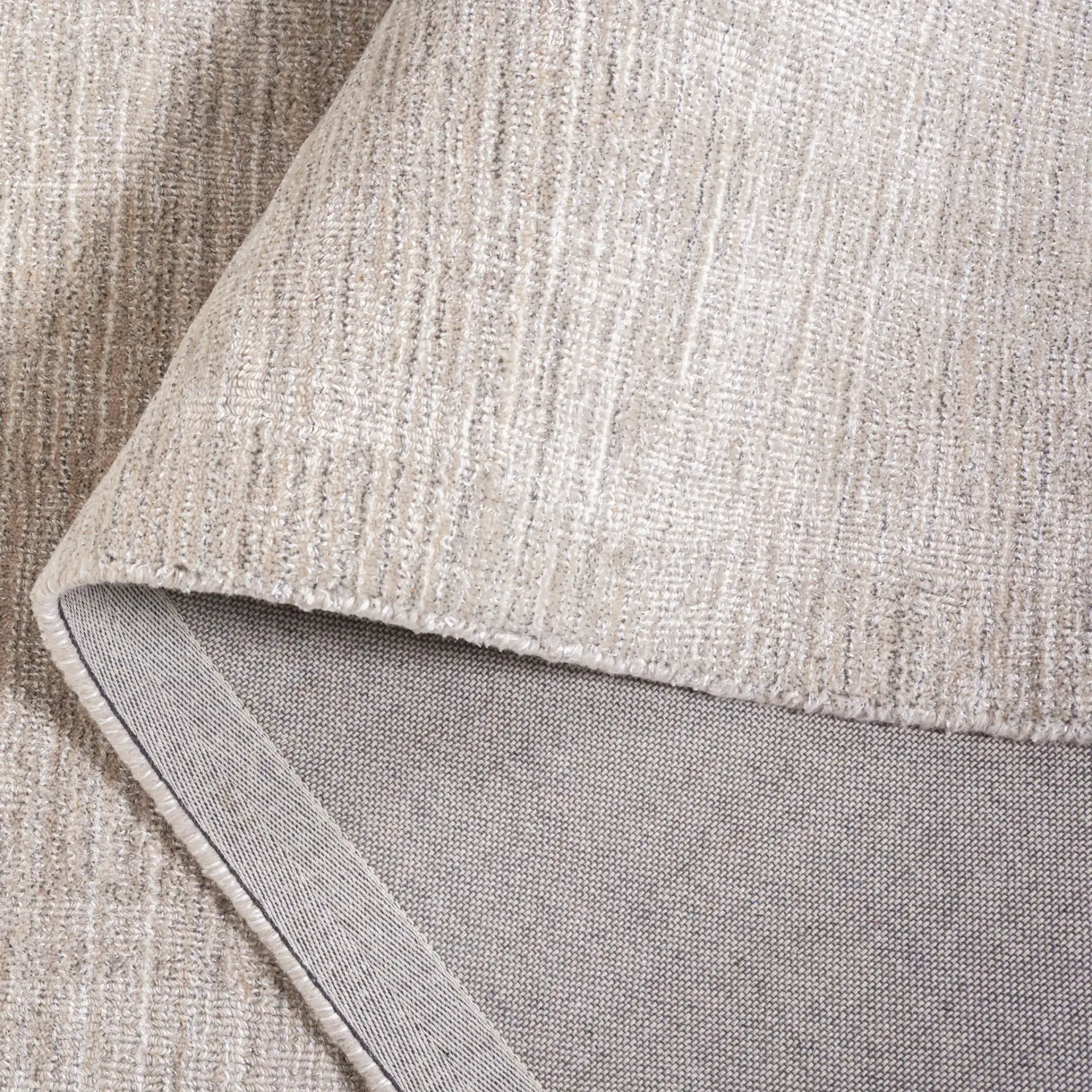 Mirage Textured Linear Hand-Loomed Rug in Beige in a styled room
