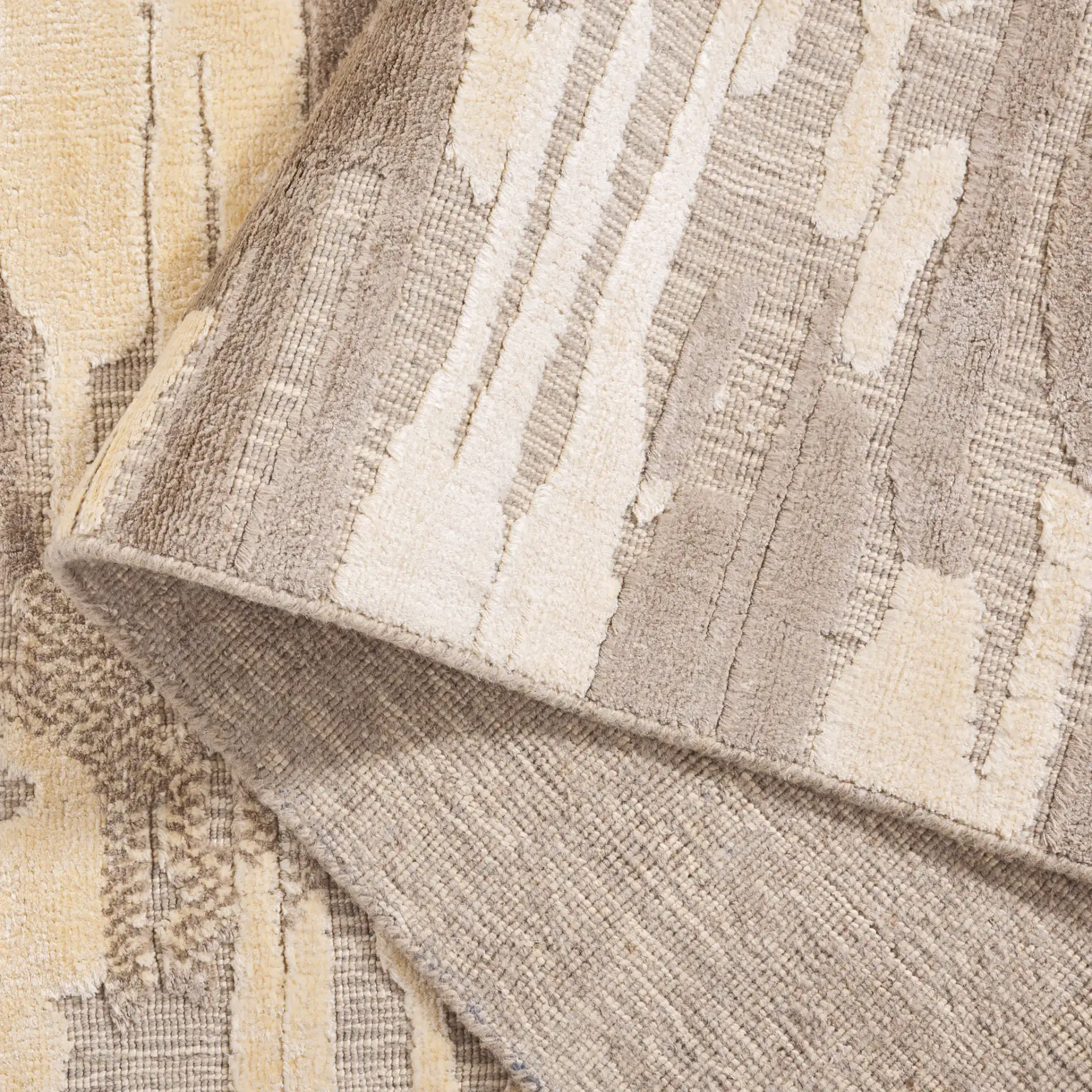 Mirage Abstract Stripe Hand-Loomed Rug in Brown / Gray in a styled room