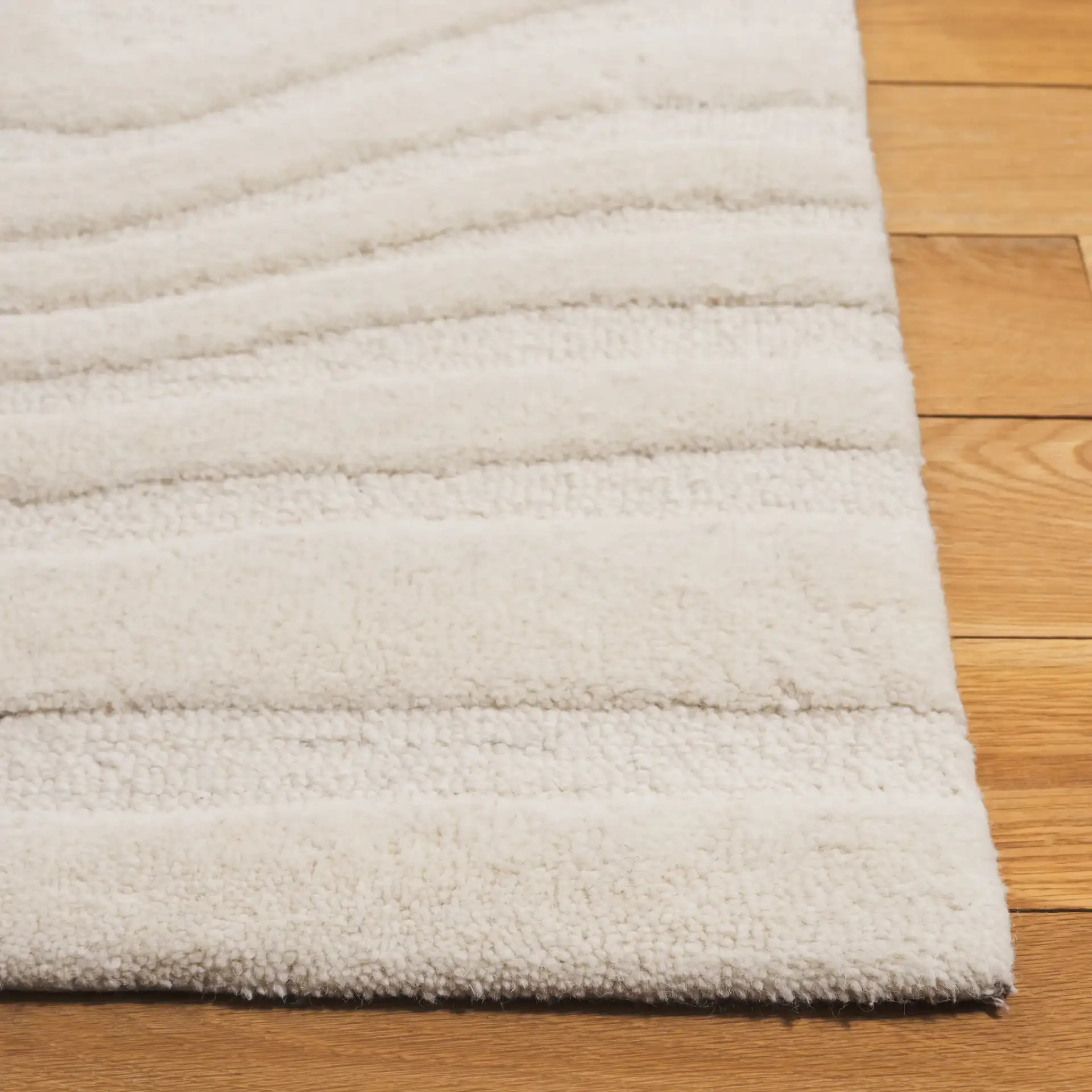 Mykonos Organic Wave Hand-Tufted Wool Rug in Ivory in a styled room