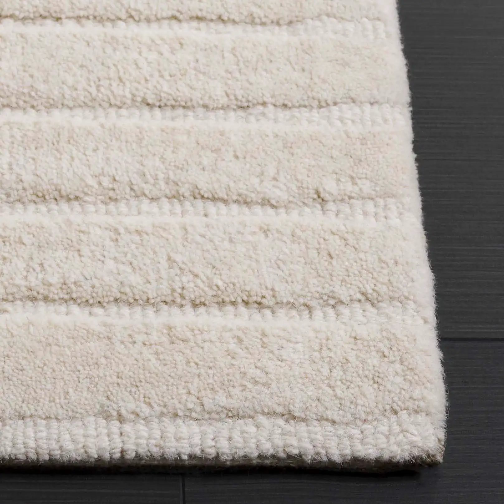 Mykonos Concentric Arch Hand-Tufted Wool Rug in Ivory in a styled room