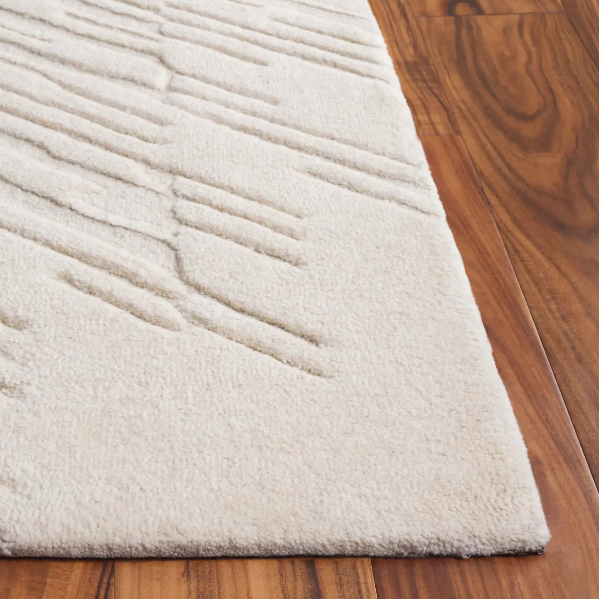 Mykonos Textured Stripe Hand-Tufted Wool Rug in Ivory in a styled room