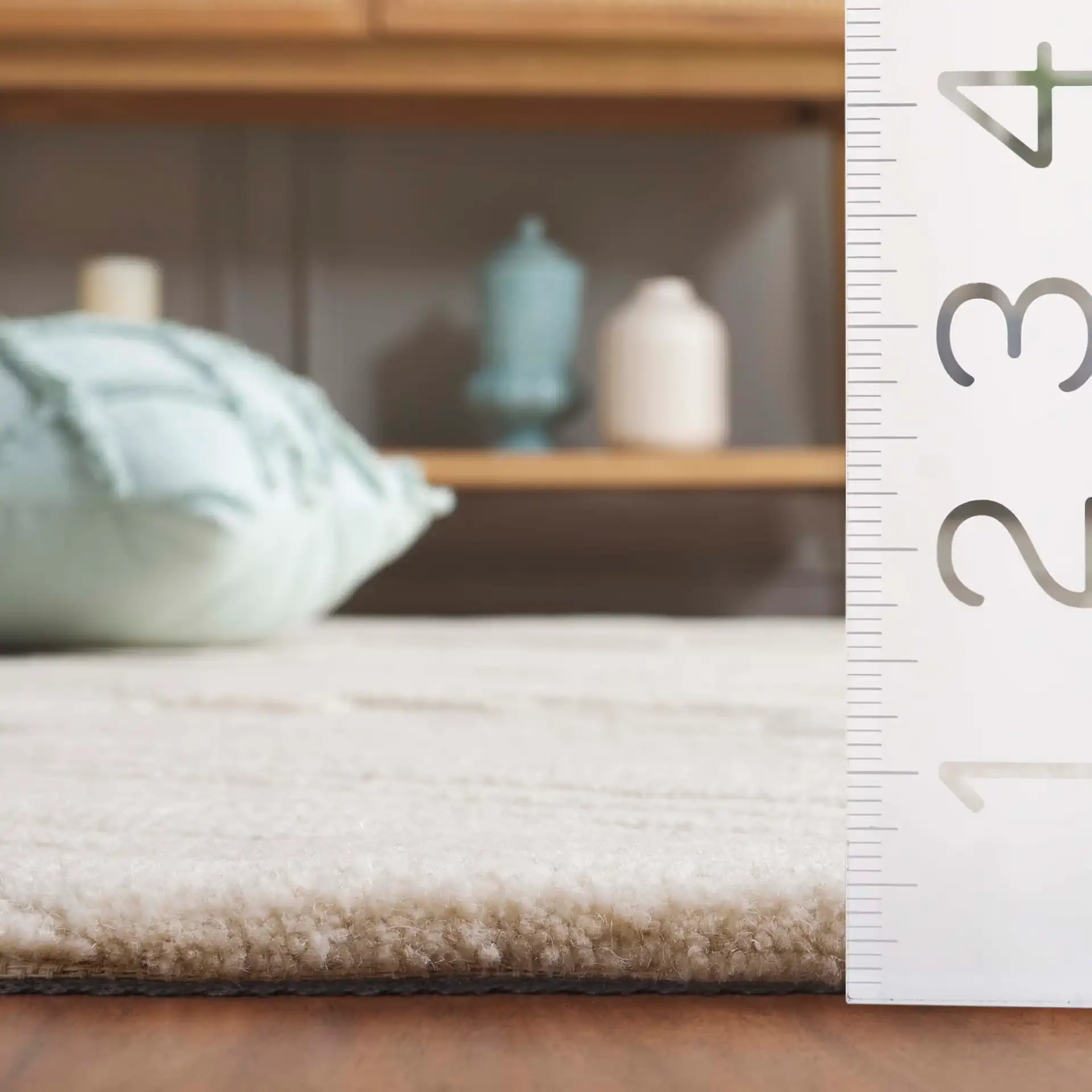 Mykonos Textured Stripe Hand-Tufted Wool Rug in Ivory in a styled room