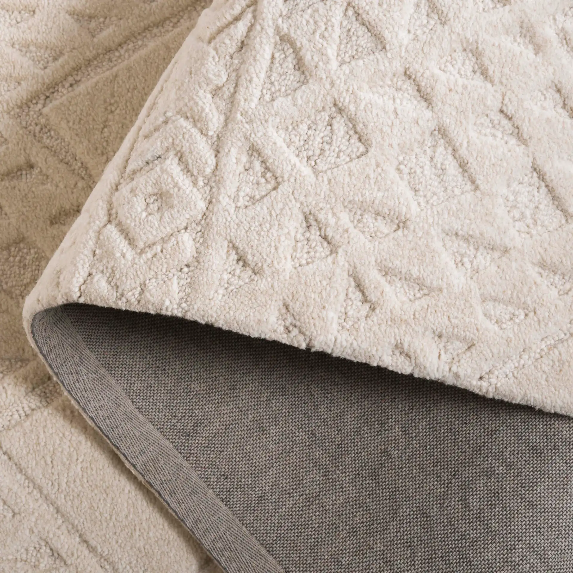 Mykonos Textured Diamond Hand-Tufted Wool Rug in Ivory in a styled room