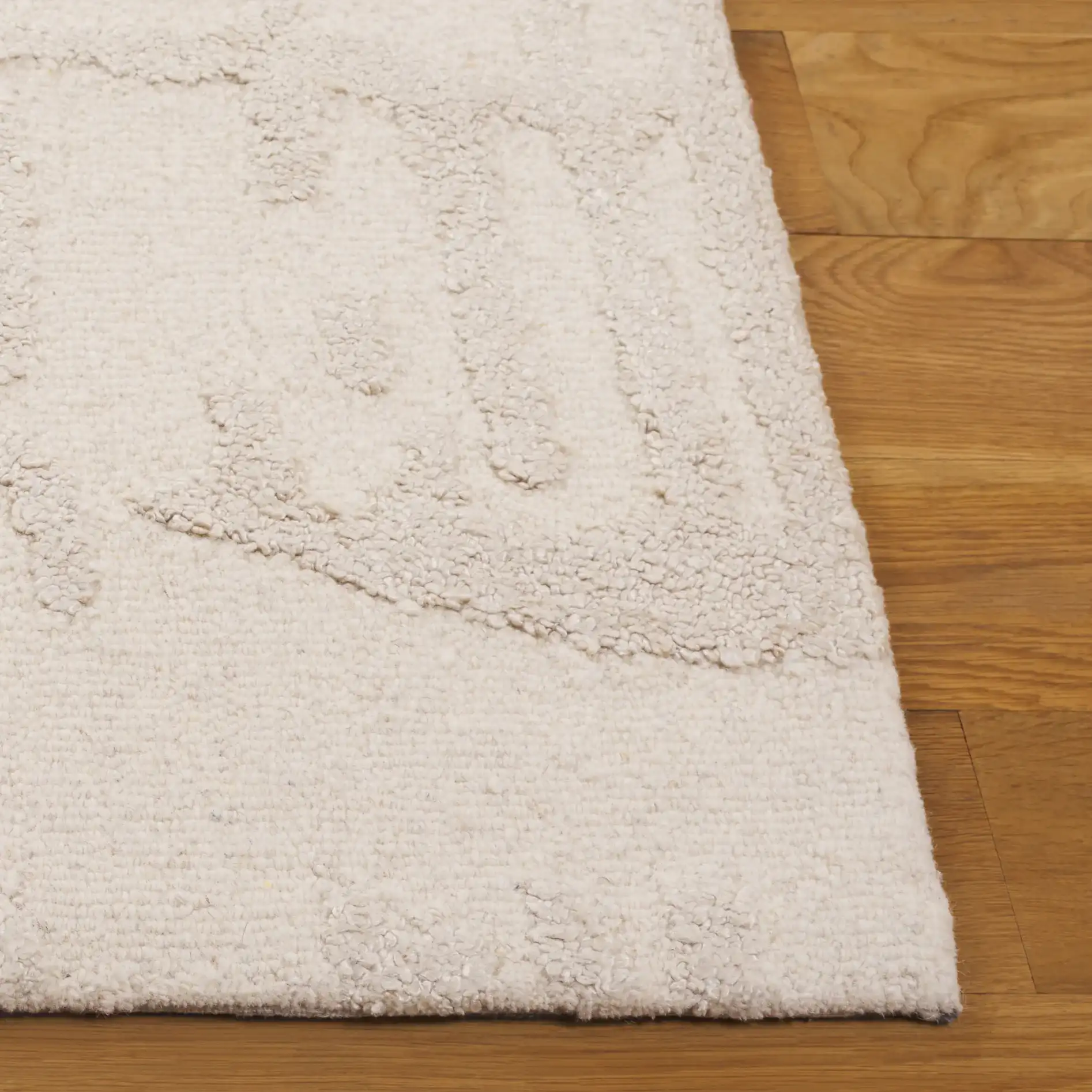 Mykonos Textured Abstract Hand-Tufted Rug in Ivory / Beige in a styled room