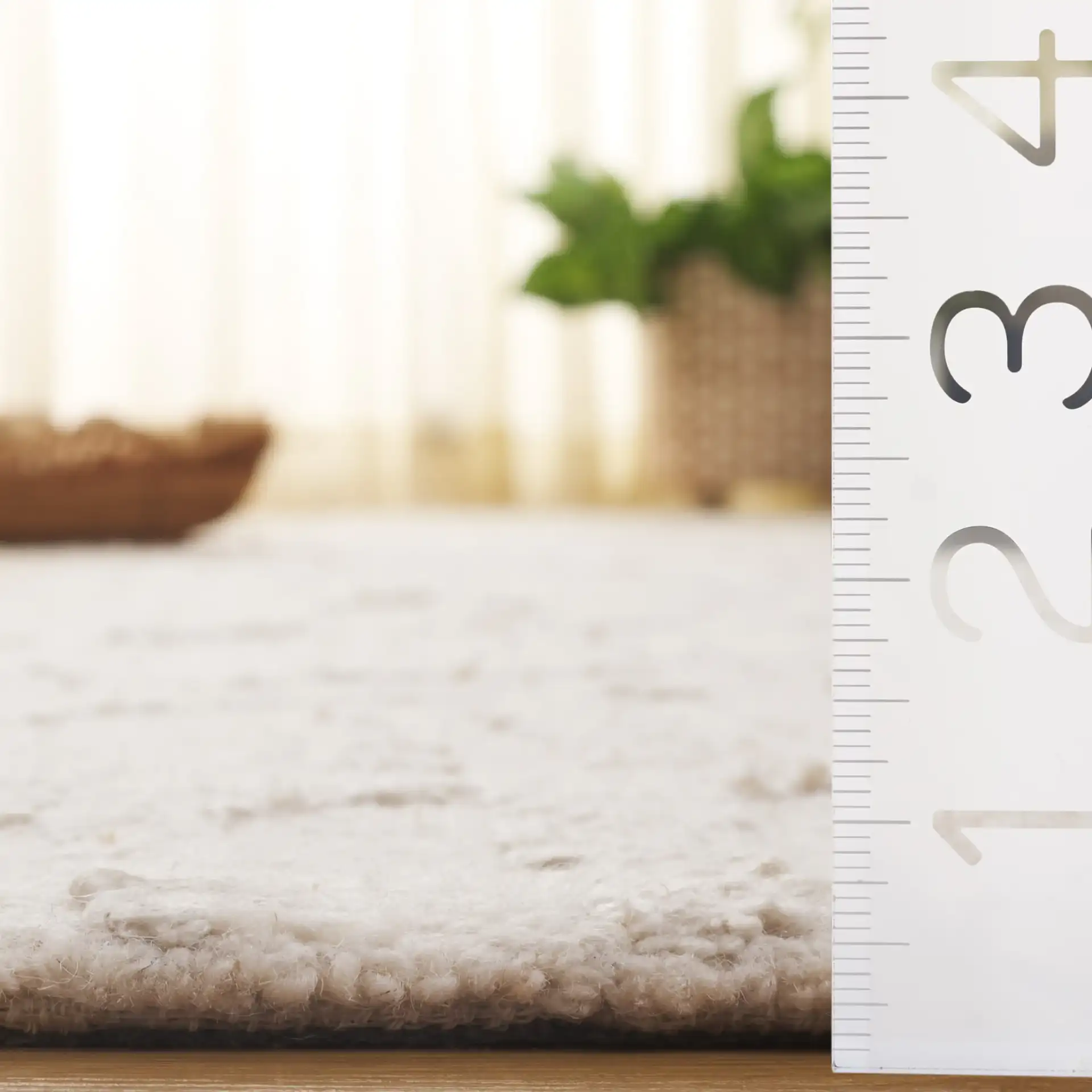 Mykonos Textured Abstract Hand-Tufted Rug in Ivory / Beige in a styled room