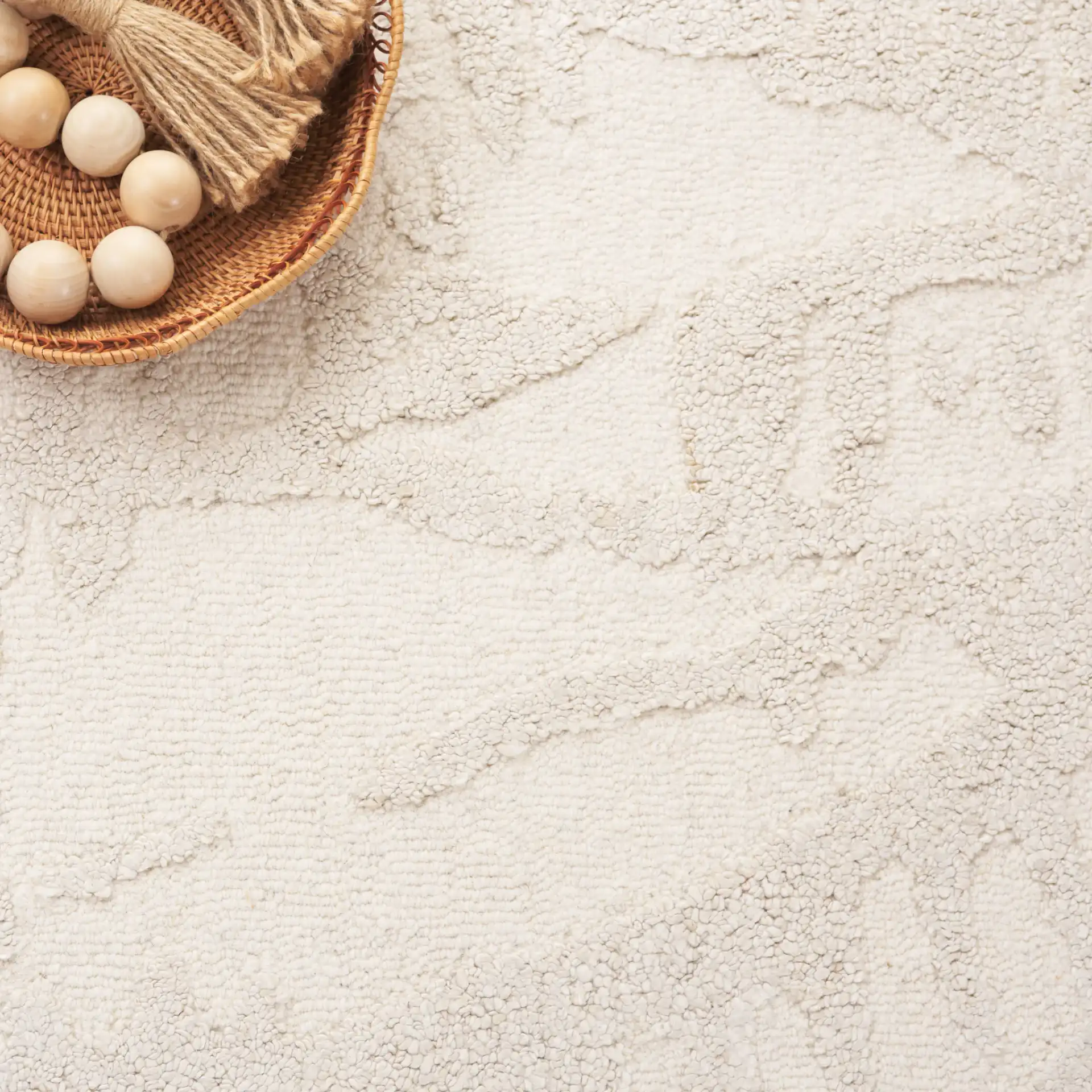 Mykonos Textured Abstract Hand-Tufted Rug in Ivory / Beige in a styled room