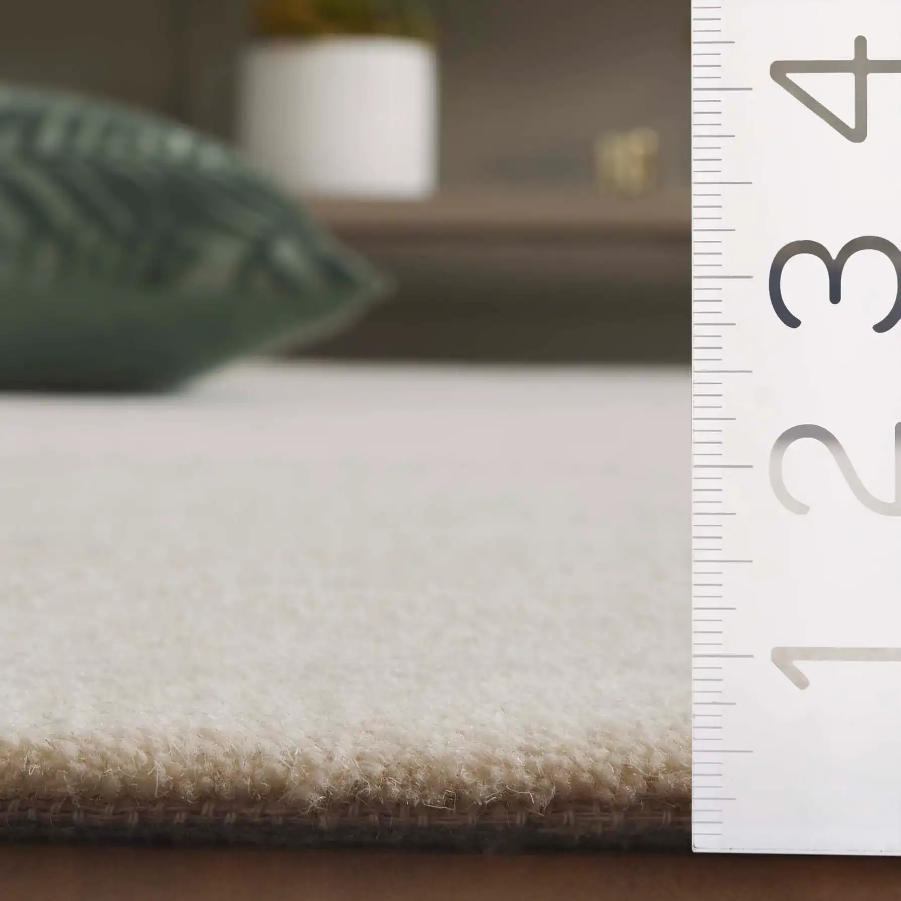 Mykonos Abstract Leaf Hand-Tufted Wool Rug in Ivory / Gray in a styled room