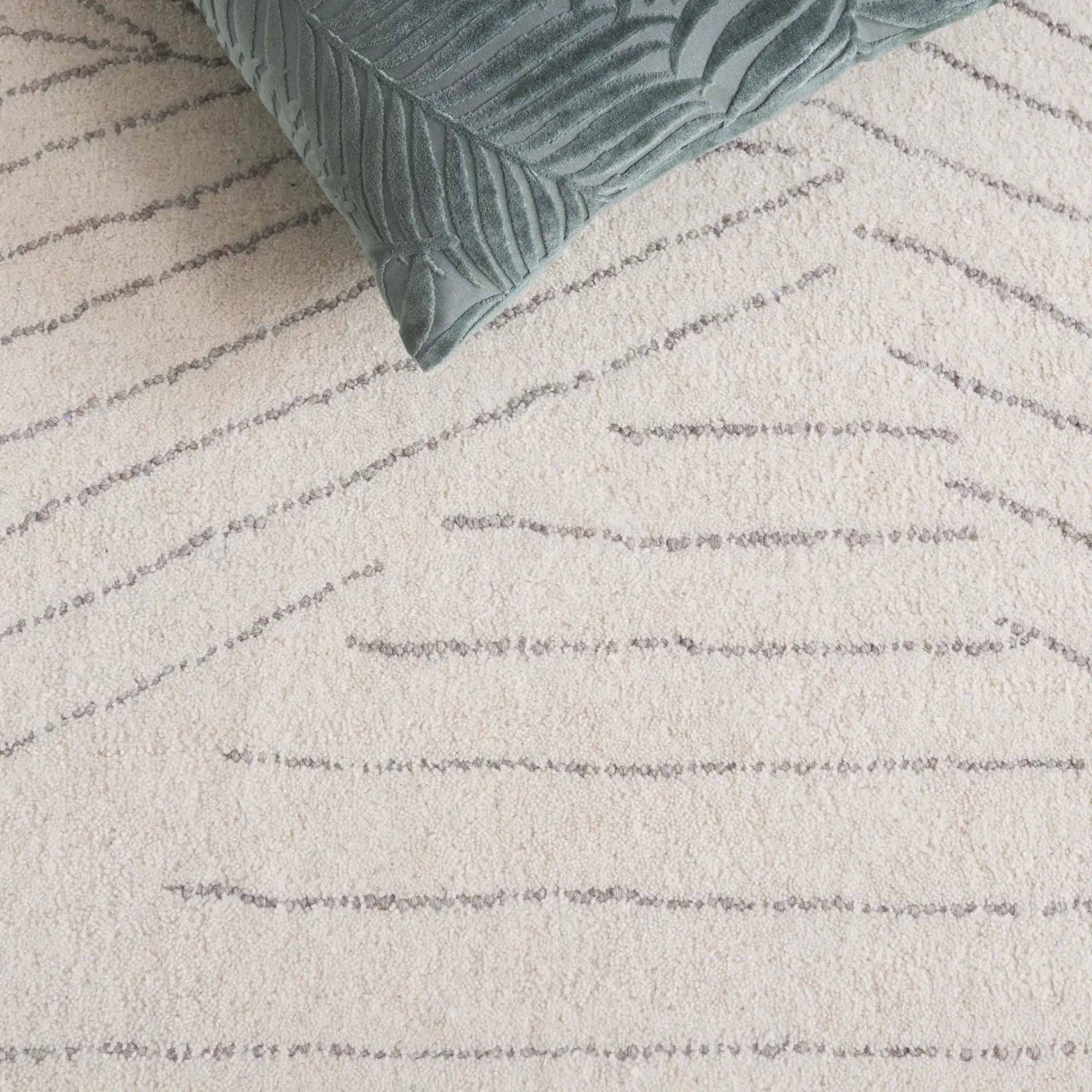 Mykonos Abstract Leaf Hand-Tufted Wool Rug in Ivory / Gray in a styled room