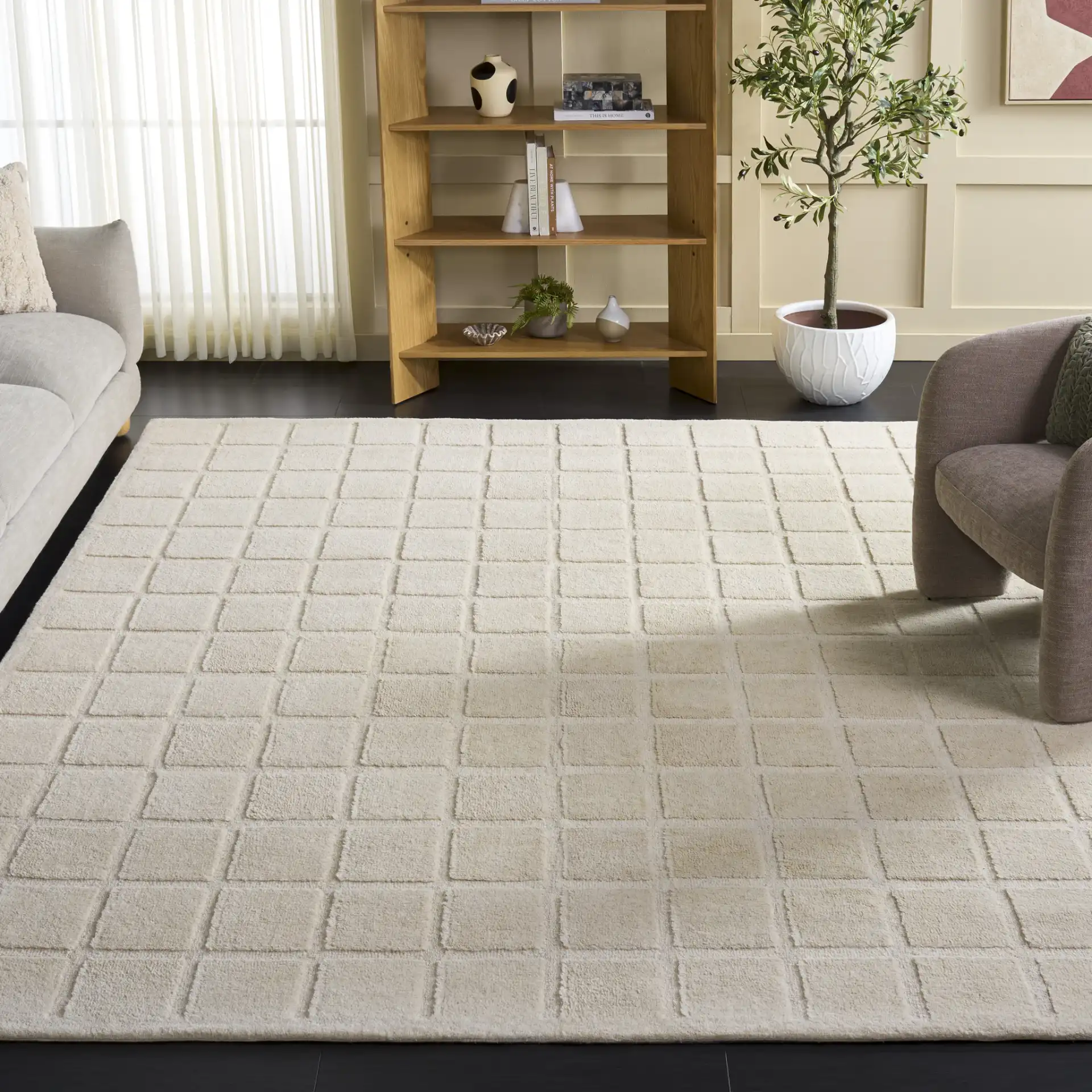Mykonos Large-Scale Grid Hand-Tufted Wool Rug in Ivory in a styled room