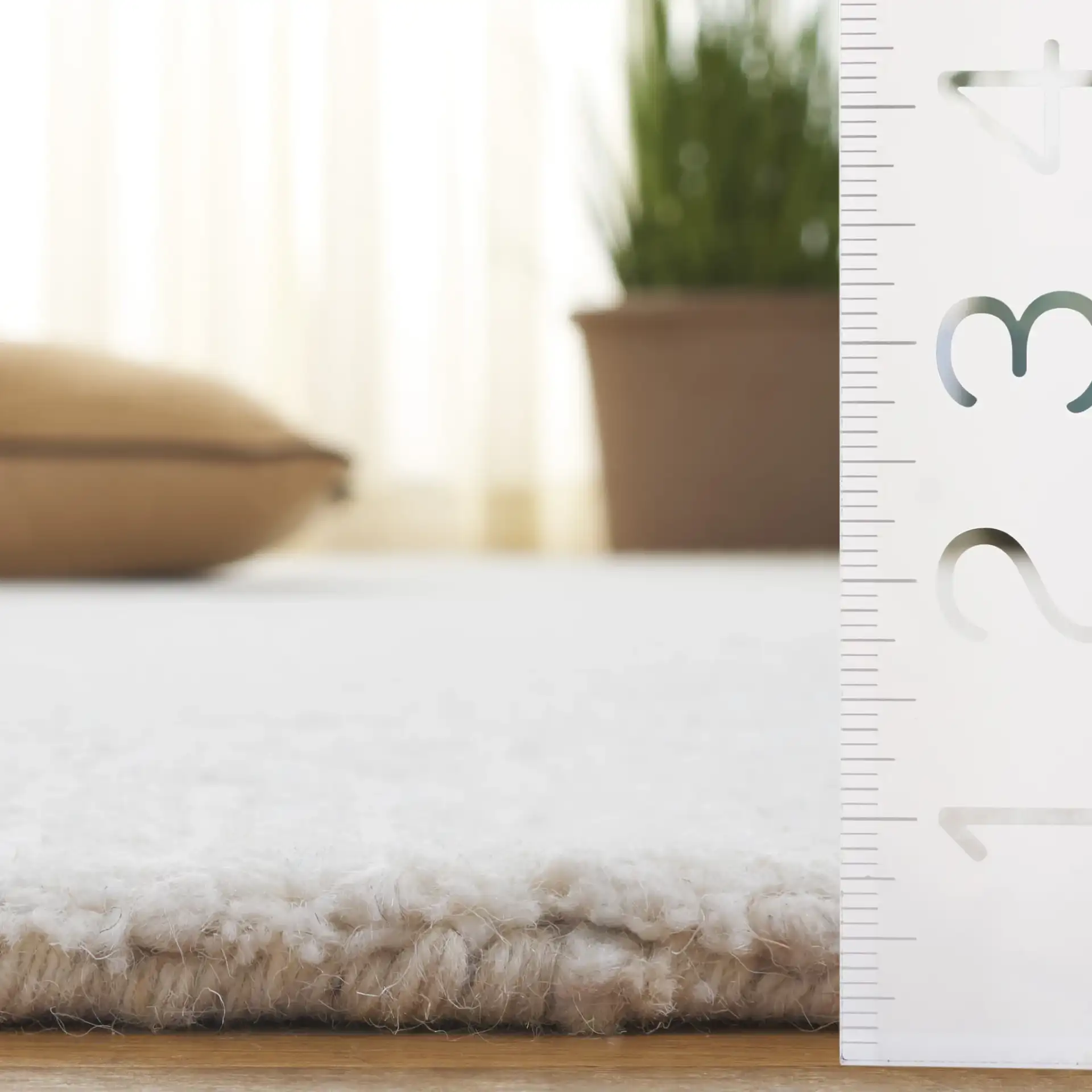 Mykonos Stepped Border Hand-Tufted Wool Rug in Ivory in a styled room