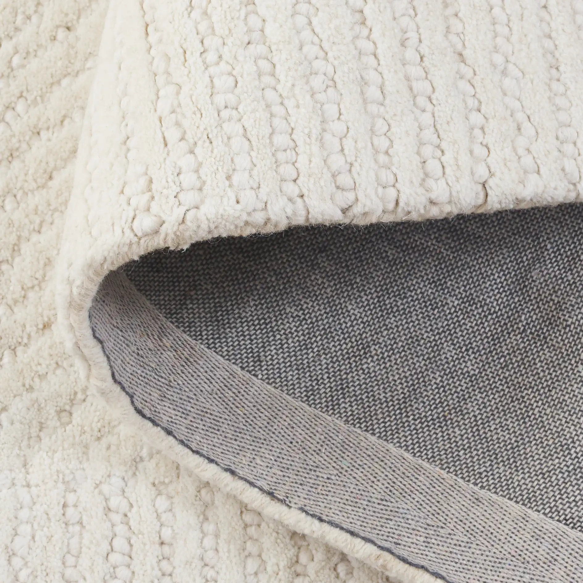 Mykonos Stepped Border Hand-Tufted Wool Rug in Ivory in a styled room