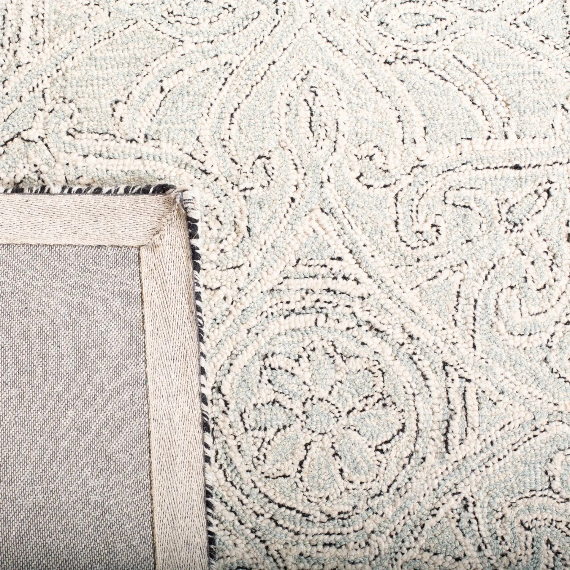 Micro-Loop Arabesque Tile Hand-Tufted Wool Rug in Gray / Ivory in a styled room