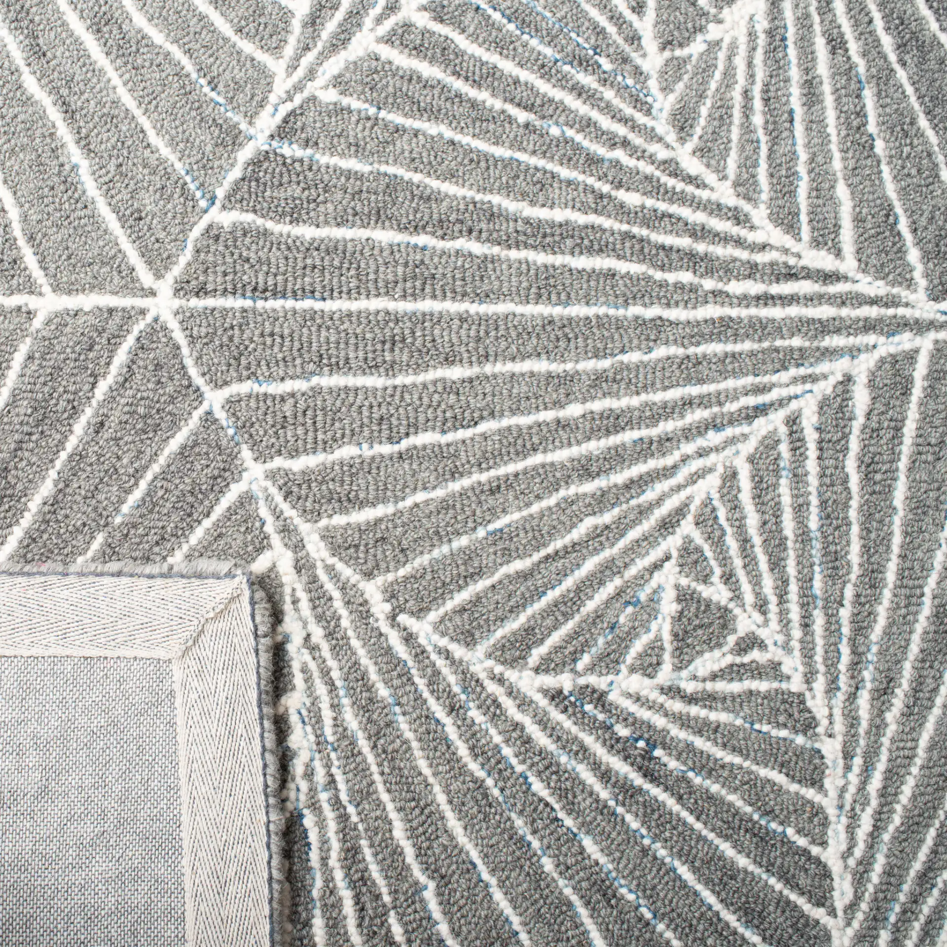 Micro-Loop Swirling Geometric Hand-Tufted Wool Rug in Gray / Ivory in a styled room