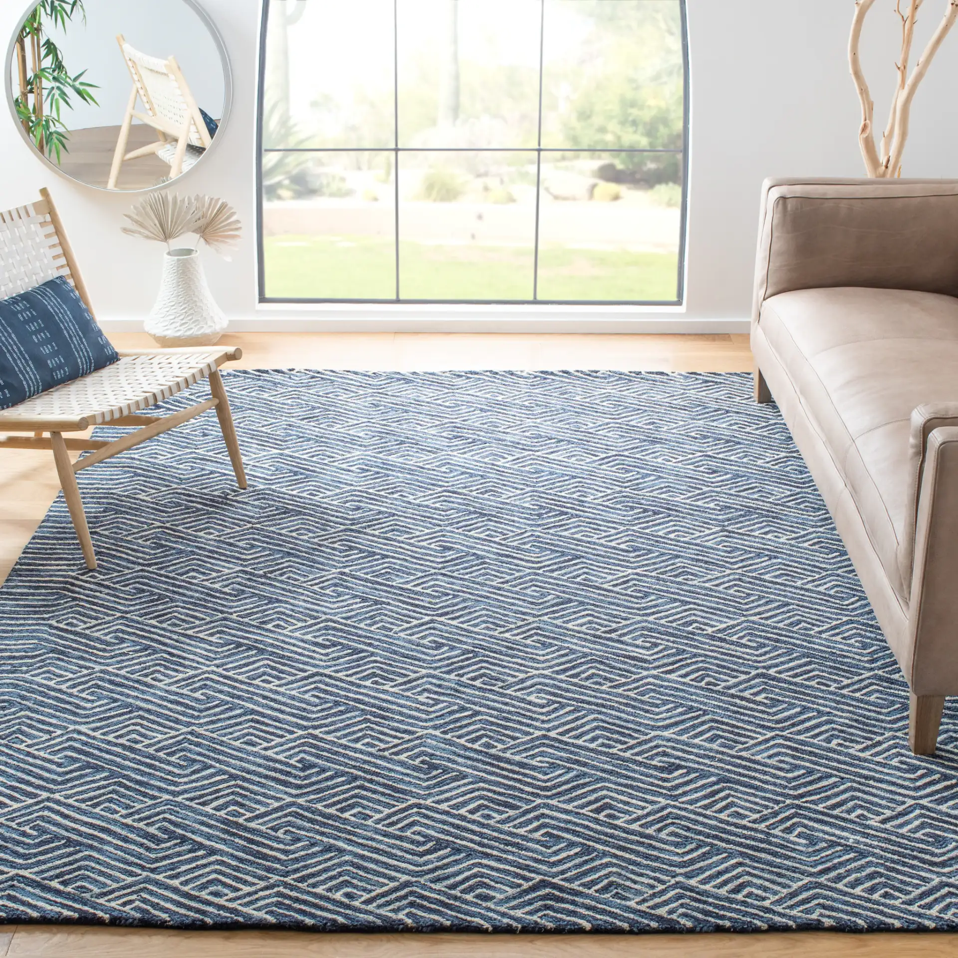 Micro-Loop Chevron Fretwork Hand-Tufted Wool Rug in Dark Blue / Ivory in a styled room