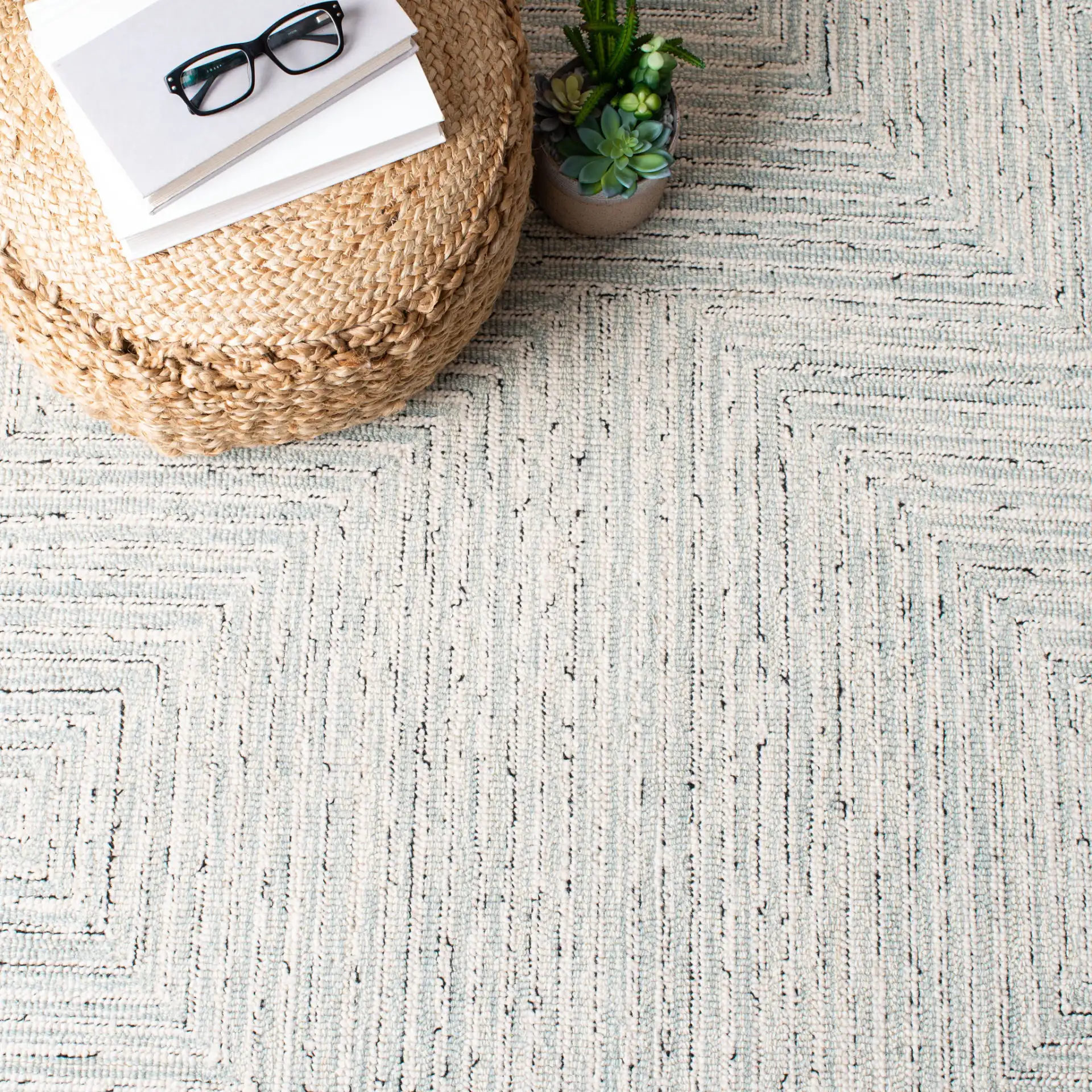 Micro-Loop Concentric Maze Hand-Tufted Wool Rug in Light Gray / Ivory in a styled room